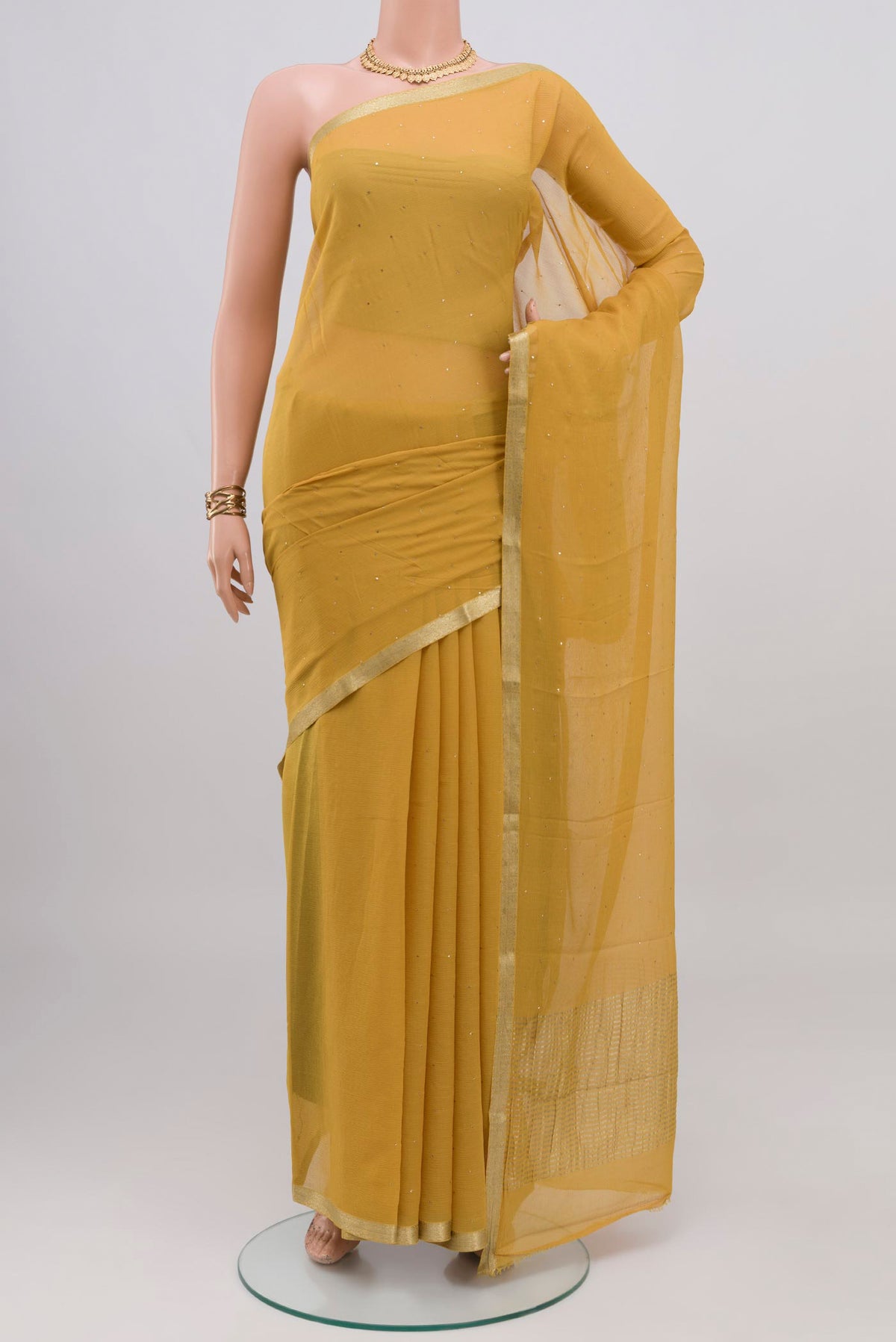 Sandal Mysore Chiffon Saree with Embroidery on the body and Zari Border.  displayed on a mannequin