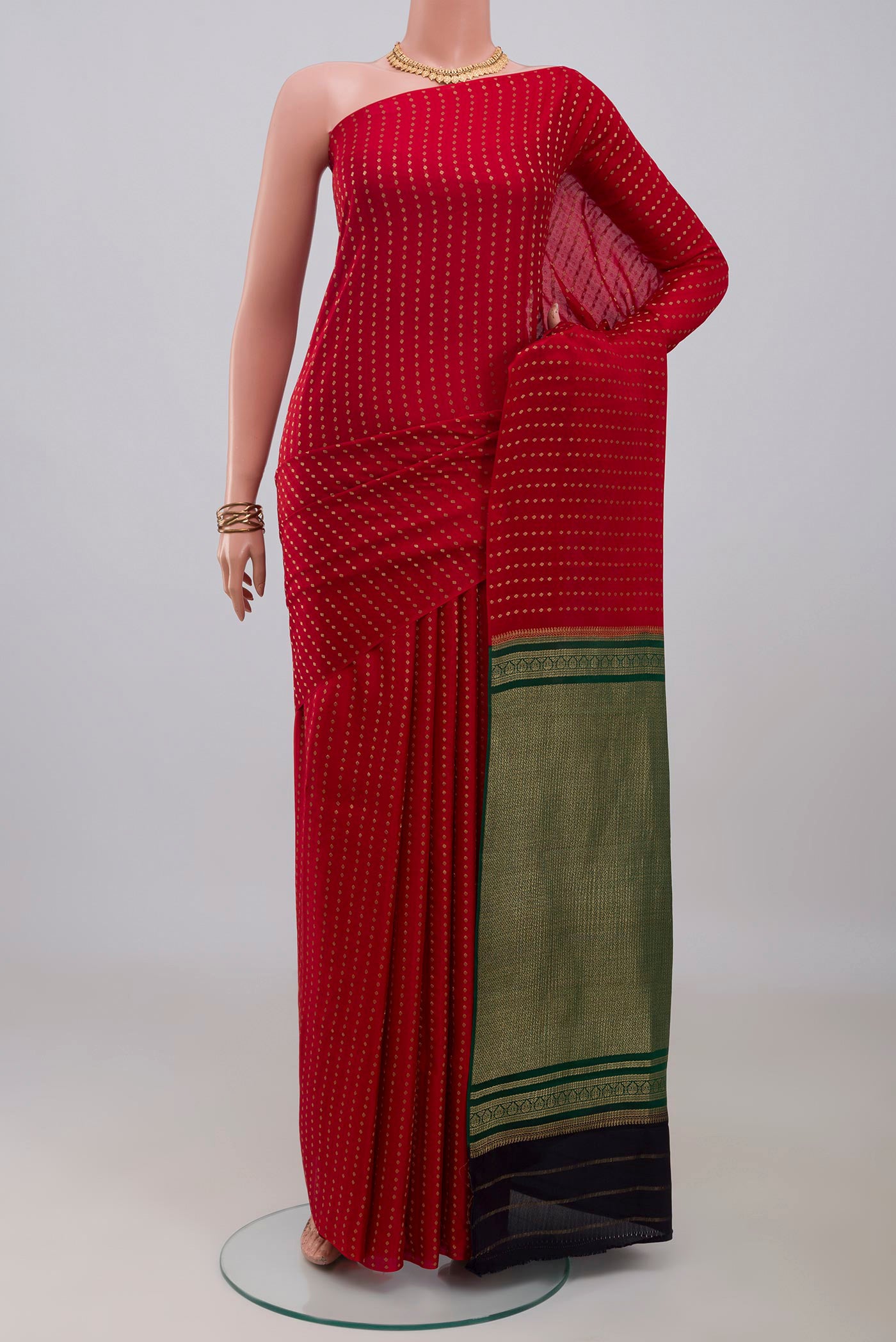 Red Mysore Crepe Saree with Zari Butta on the body and Without Border.  displayed on a mannequin
