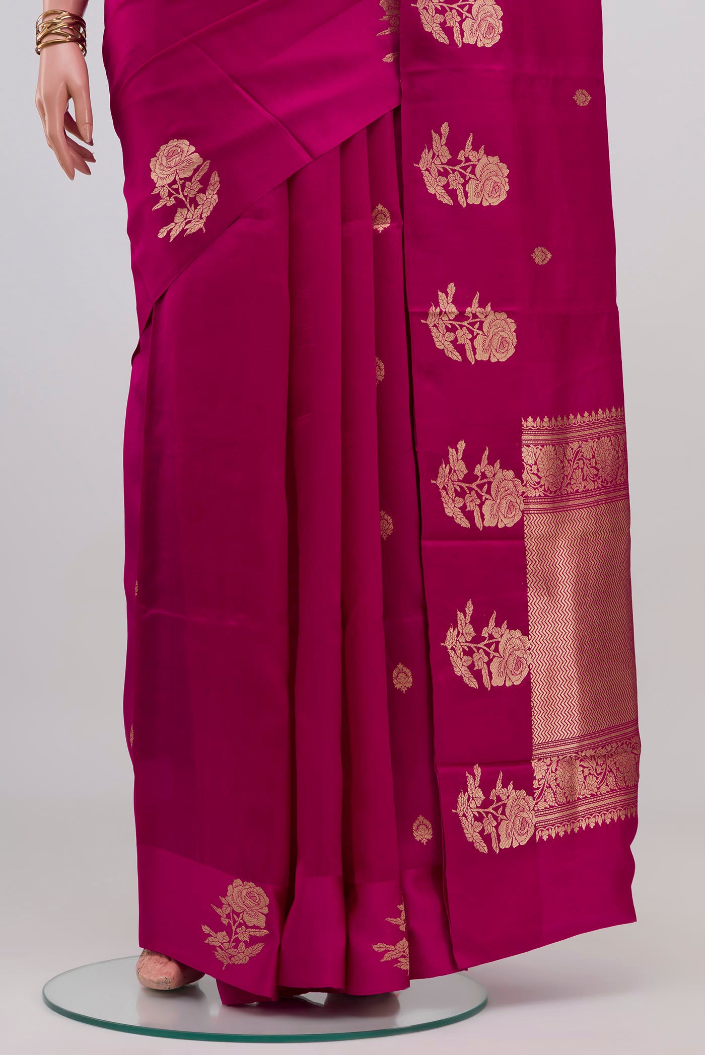 Pleats and pallu of Magenta Banarasi Katan Silk Saree with Zari Butta on the body and Fancy Border. 