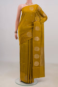 Pure Silk Mustard Banarasi Katan Saree with Zari Butta on the body and Fancy Border.  displayed on a mannequin