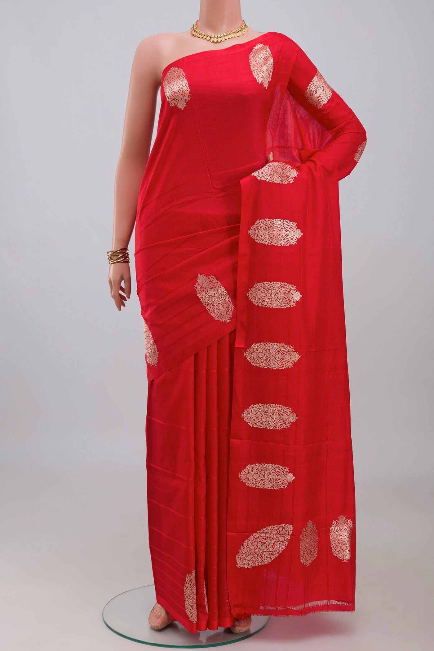 Red Banarasi Katan Silk Saree with Plain Body and Fancy Border.  displayed on a mannequin
