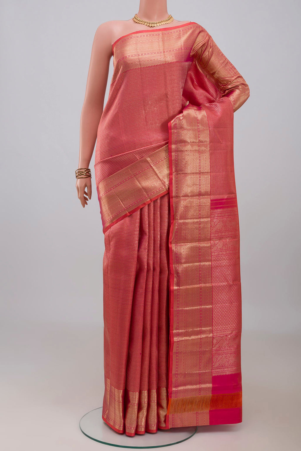 Pink Kanchipuram Silk Saree with Zari Brocade on the body and Zari Border.  displayed on a mannequin