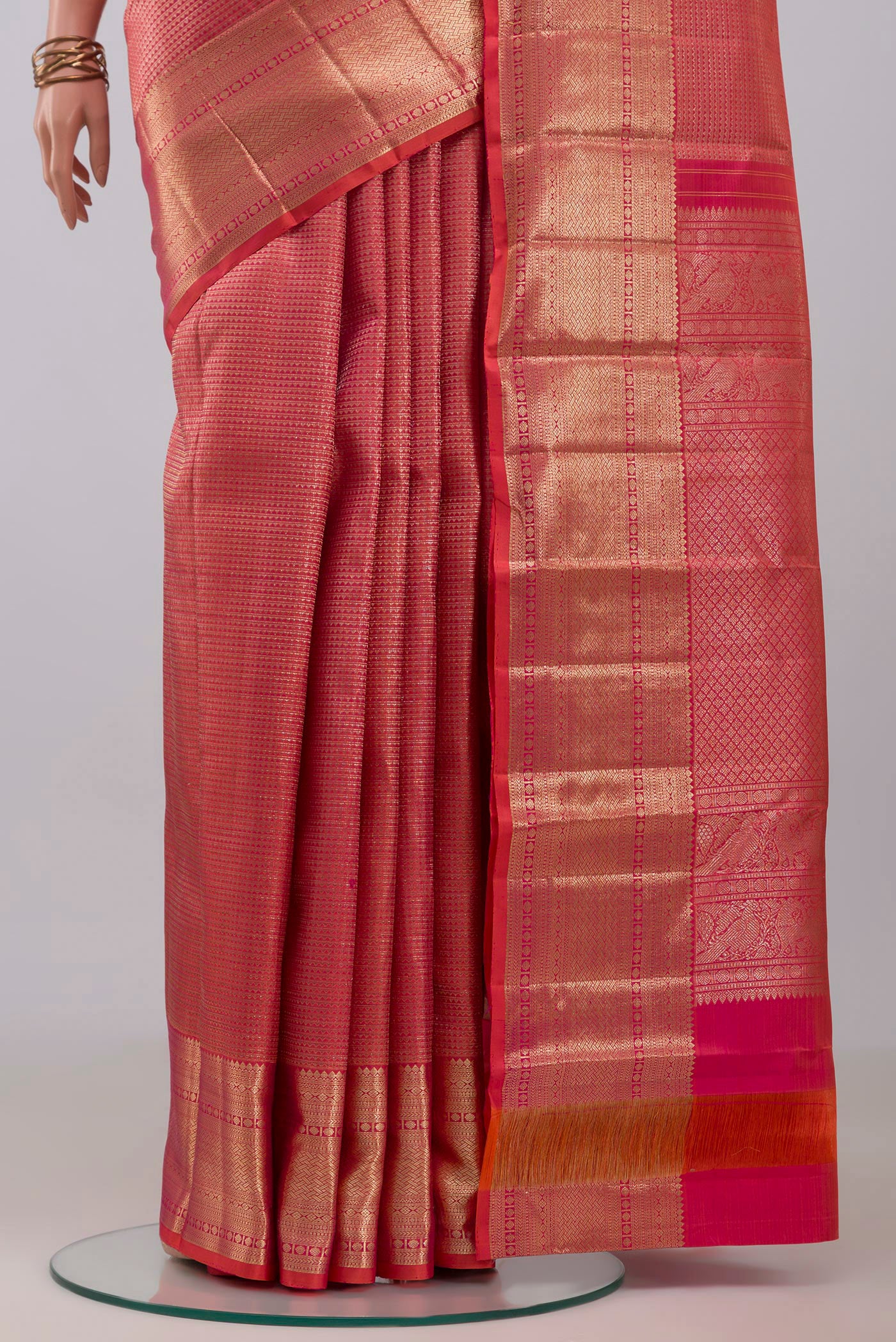Pleats and pallu of Pink Kanchipuram Silk Saree with Zari Brocade on the body and Zari Border. 