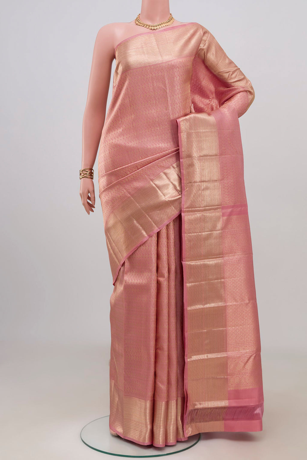 Pink Kanchipuram Silk Saree with Zari Brocade on the body and Zari Border.  displayed on a mannequin