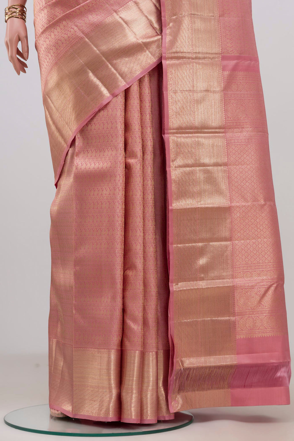 Pleats and pallu of Pink Kanchipuram Silk Saree with Zari Brocade on the body and Zari Border. 