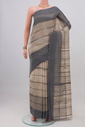Beige Tussar Silk Saree with Printed design on the body and Plain Border.  displayed on a mannequin