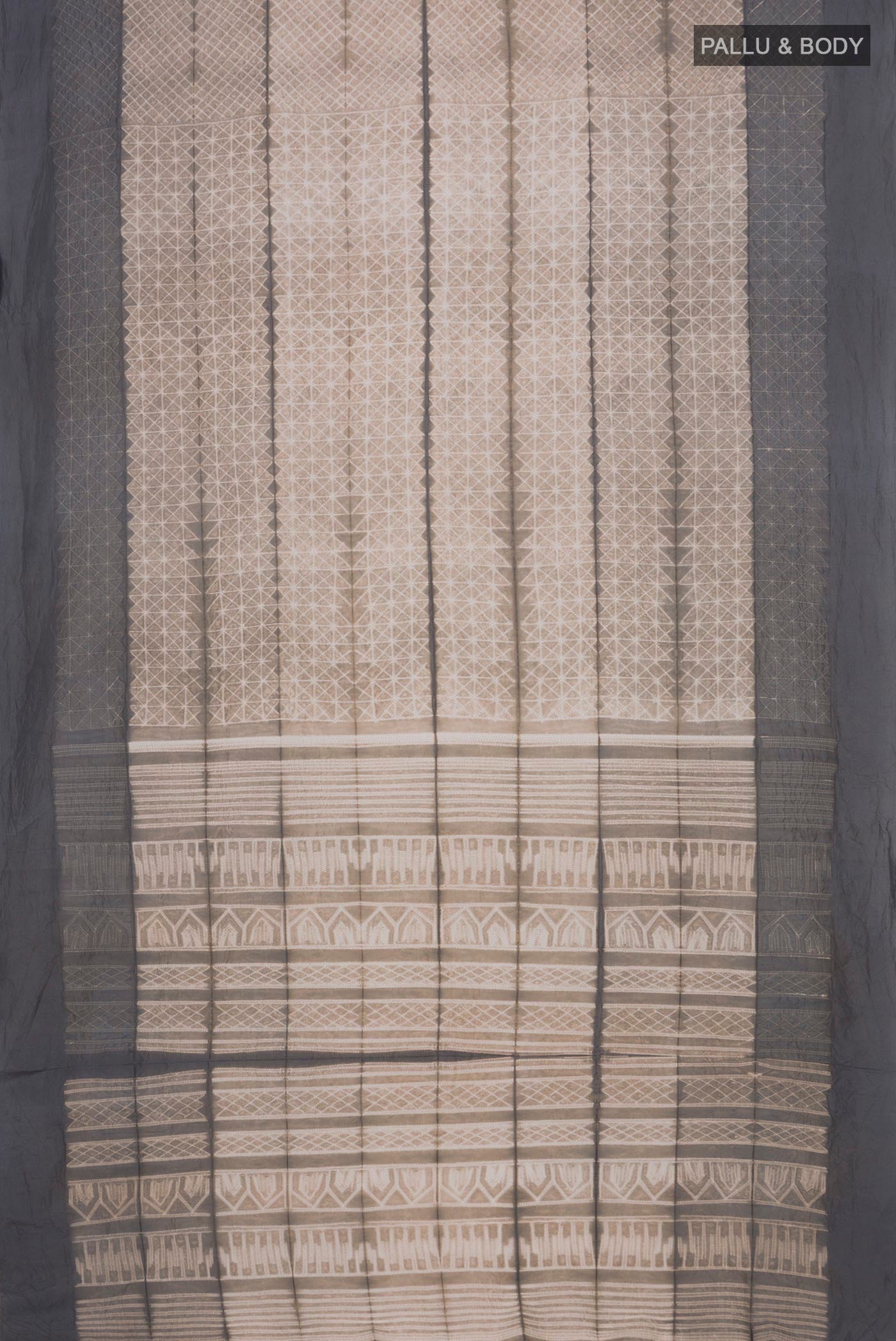 Flat view of Beige Tussar Silk Saree with Printed design on the body and Plain Border. 