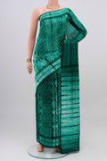 Green Tussar Silk Saree with Printed design on the body and Printed Border.  displayed on a mannequin