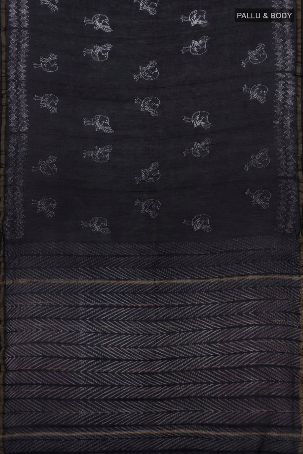 Flat view of Black Chanderi Silk Cotton Saree with Printed design on the body and Thin Zari Line. 