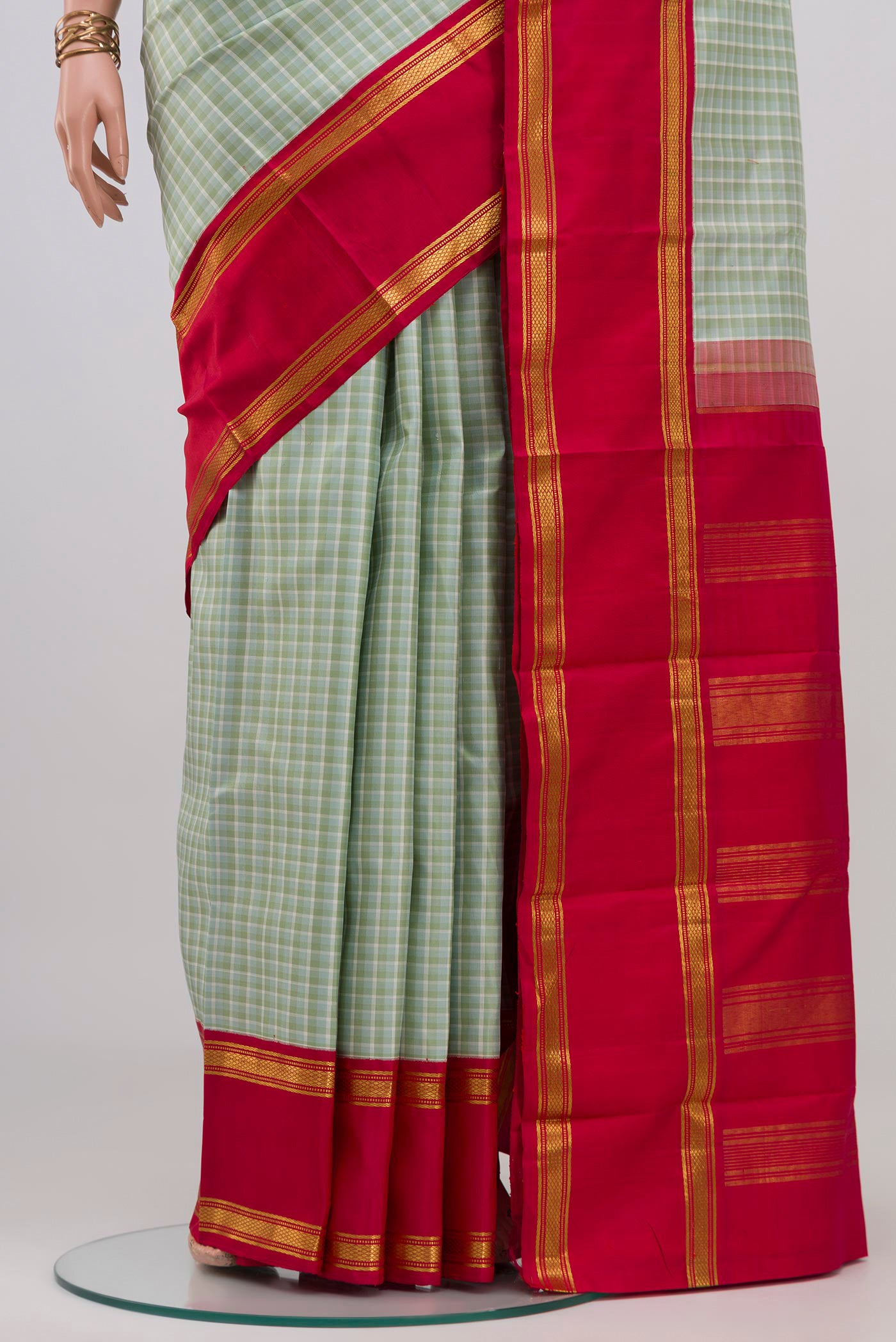 Pleats and pallu of Multi Color Kanjivaram Silk Saree with Checked design on the body and Plain Border. 