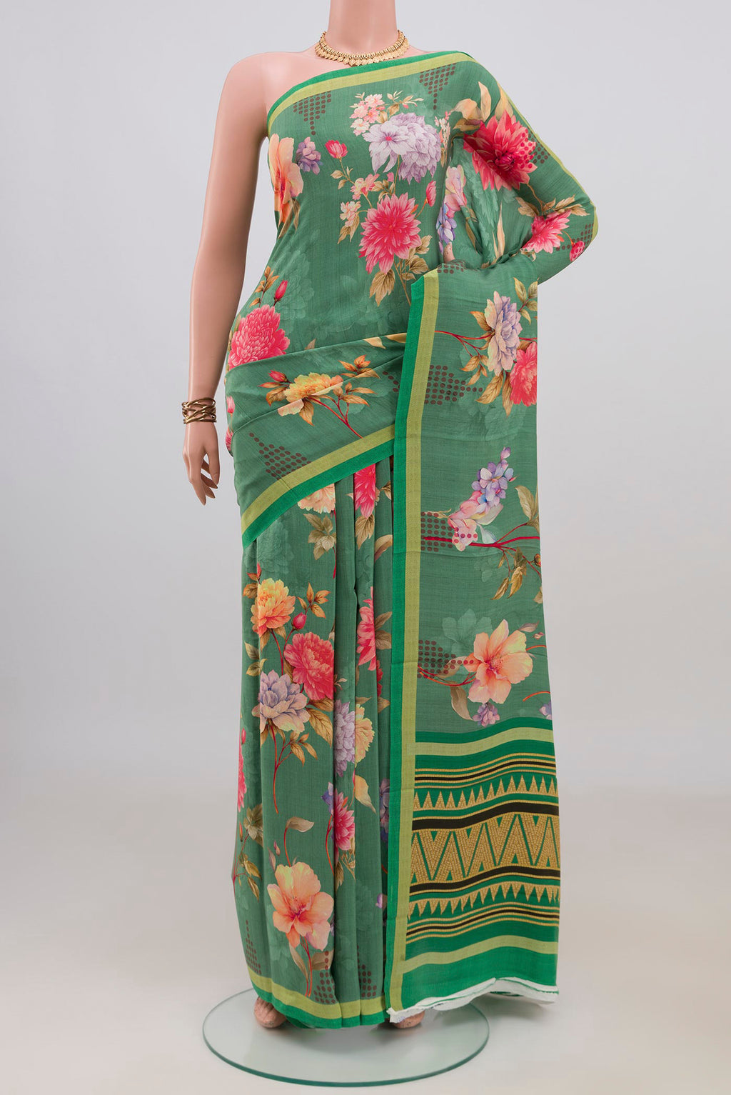 Green Crepe Saree with Floral Print on the body and Without Border.  displayed on a mannequin