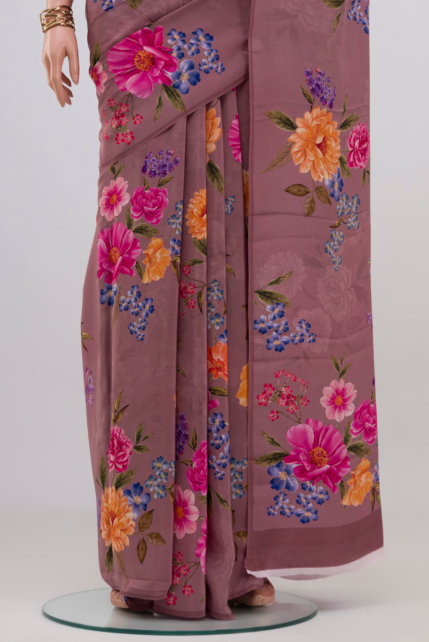Pleats and pallu of Mauve Crepe Saree with Floral Print on the body and Without Border. 