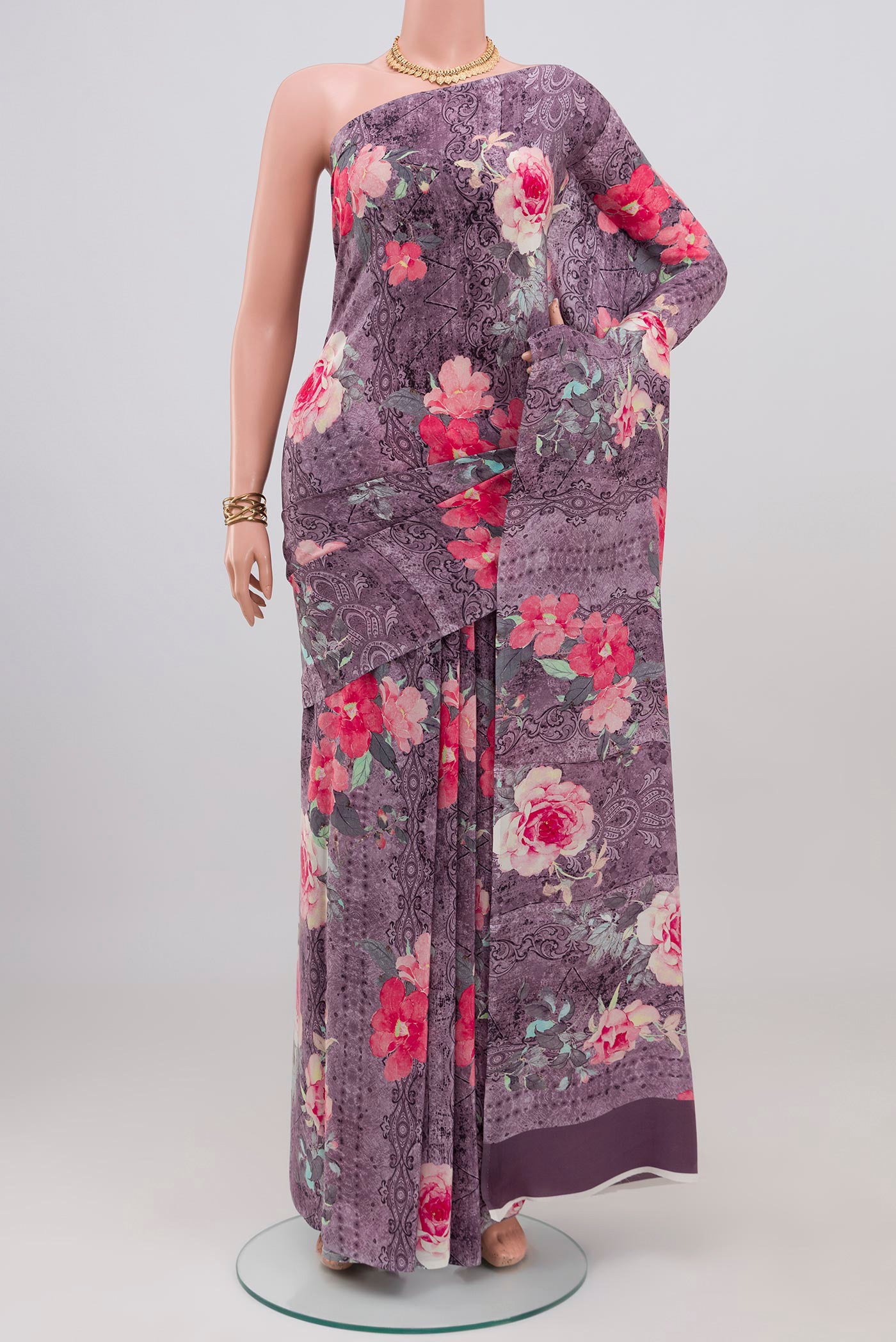 Lavender Crepe Saree with Printed design on the body and Without Border.  displayed on a mannequin