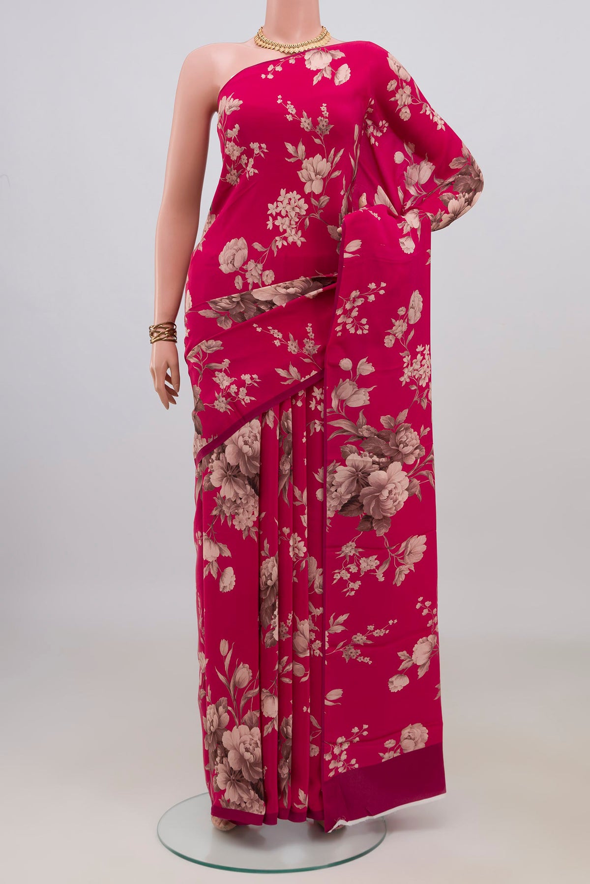 Pink Crepe Saree with Floral Print on the body and Without Border.  displayed on a mannequin