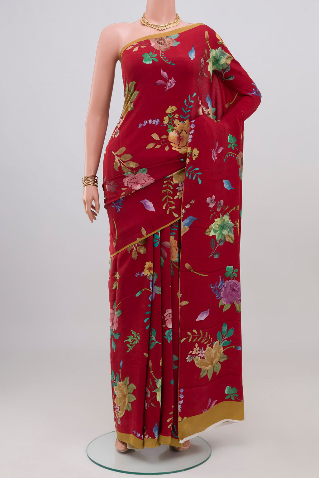 Red Crepe Saree with Floral Print on the body and Without Border.  displayed on a mannequin