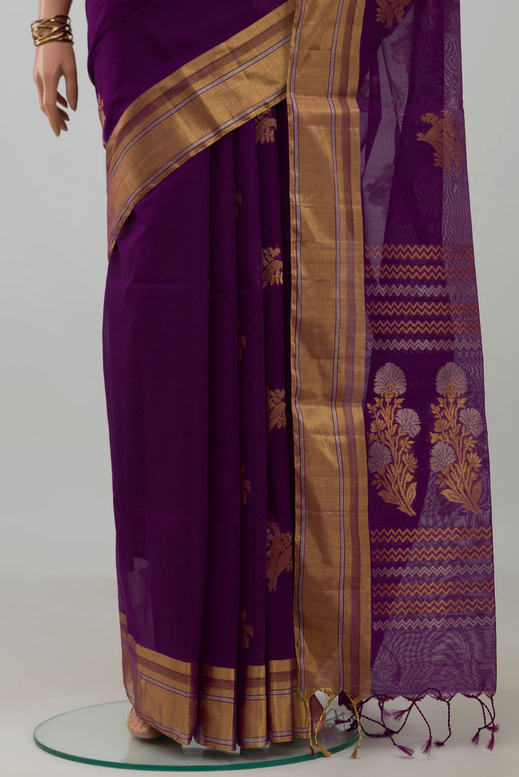 Pleats and pallu of Purple Silk Cotton Saree with Zari Butta on the body and Zari Border. 