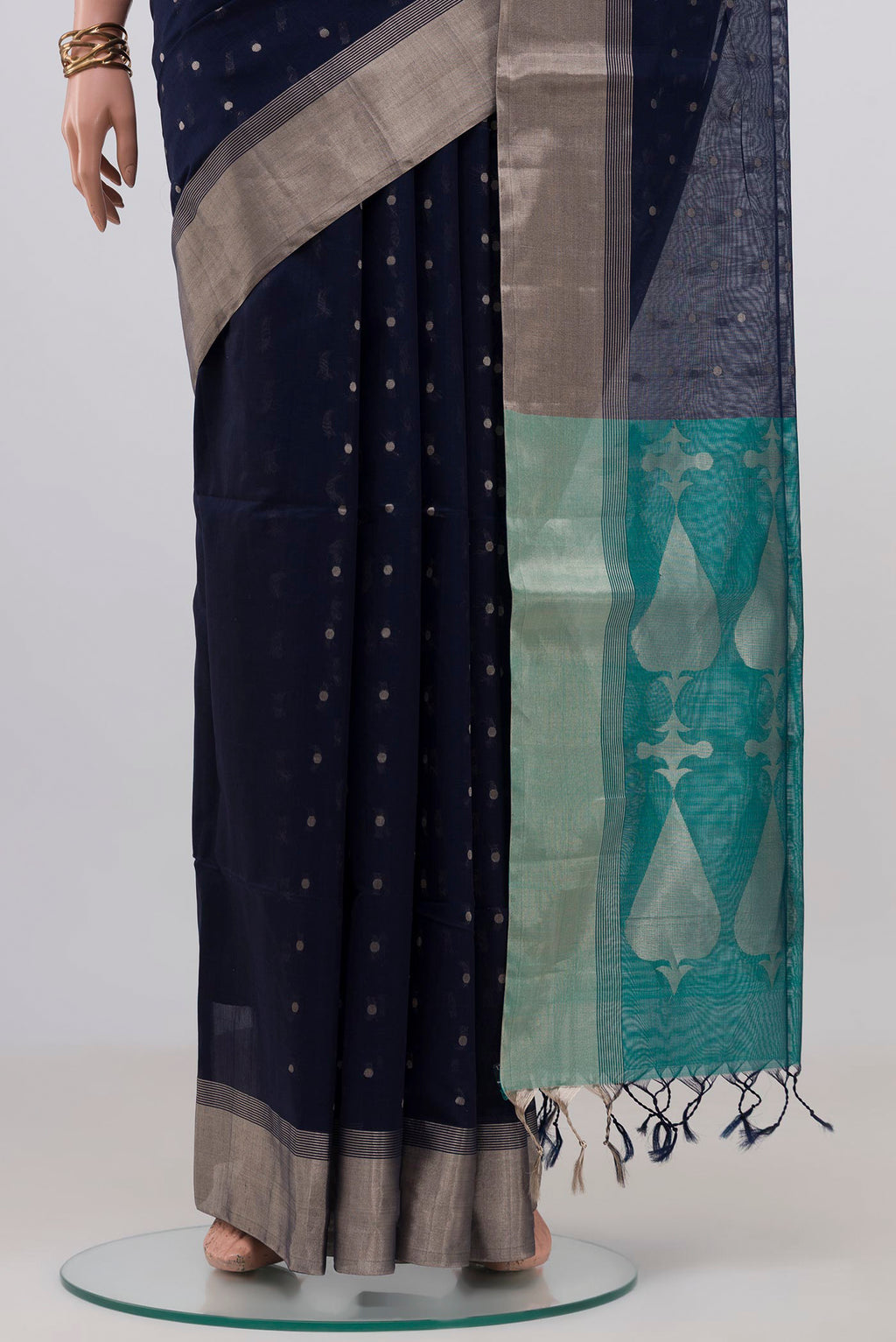 Pleats and pallu of Navy Blue Silk Cotton Saree with Zari Butta on the body and Zari Border. 