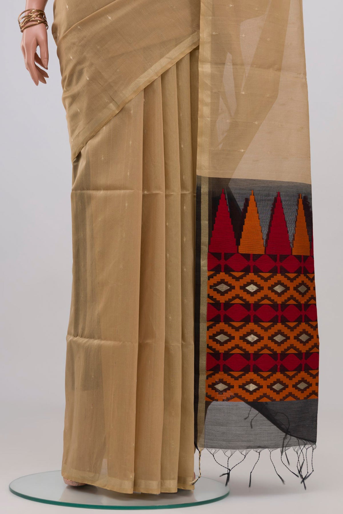 Pleats and pallu of Beige Silk Cotton Saree with Zari Butta on the body and Zari Border. 