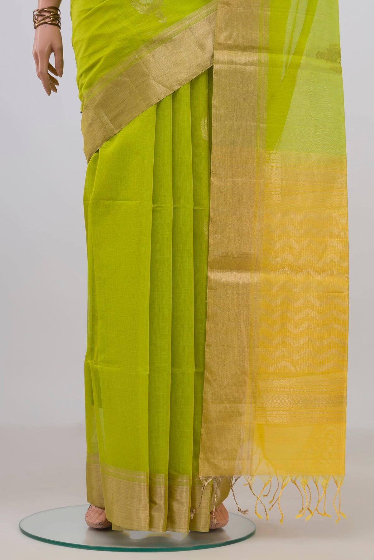 Pleats and pallu of Parrot Green Silk Cotton Saree with Zari Butta on the body and Zari Border. 