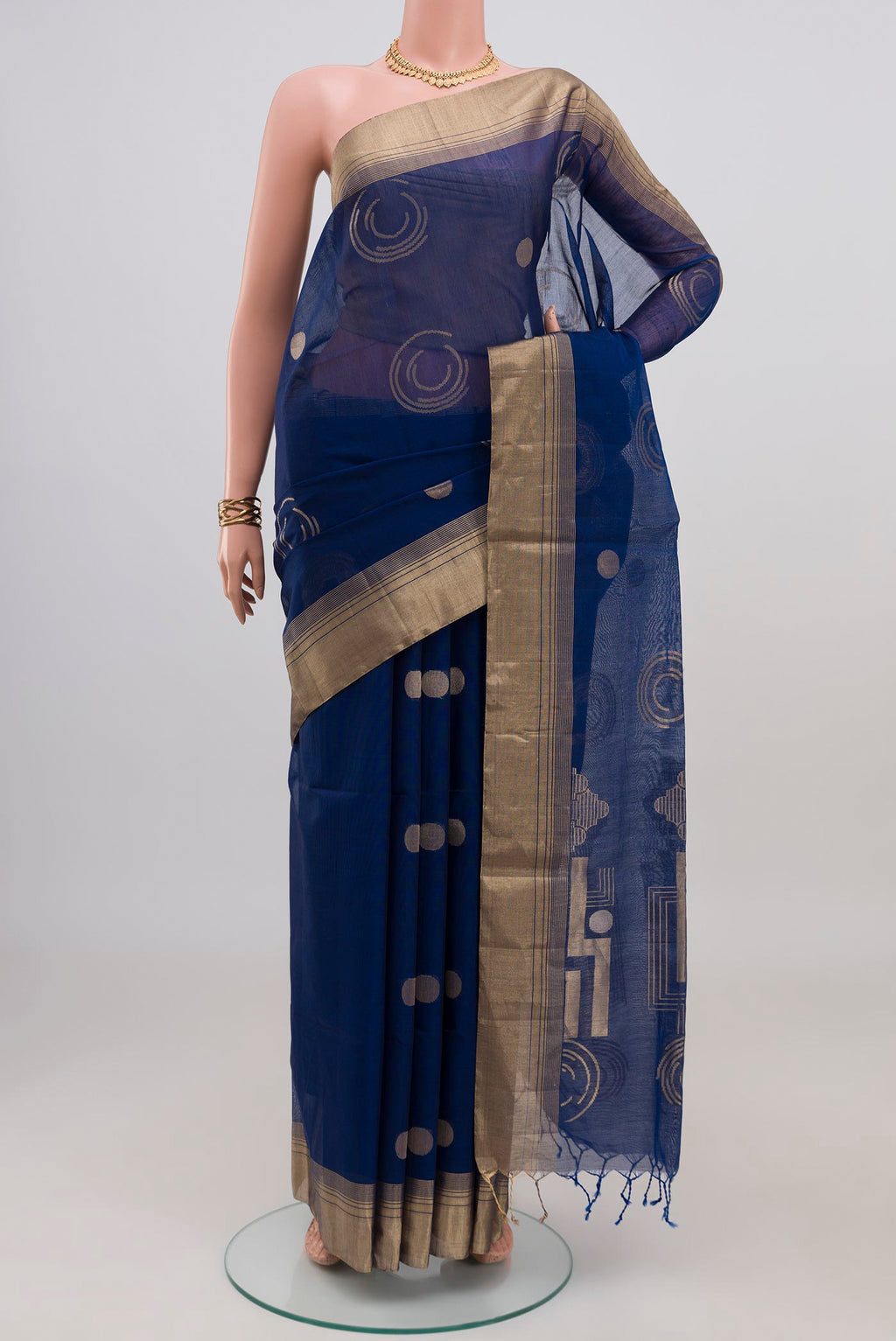 Blue Silk Cotton Saree with Zari Butta on the body and Zari Border.  displayed on a mannequin