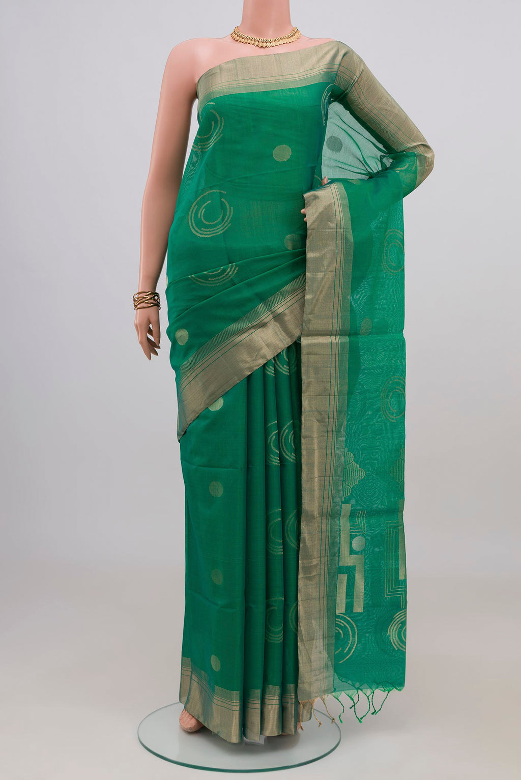 Teal Silk Cotton Saree with Zari Butta on the body and Zari Border.  displayed on a mannequin