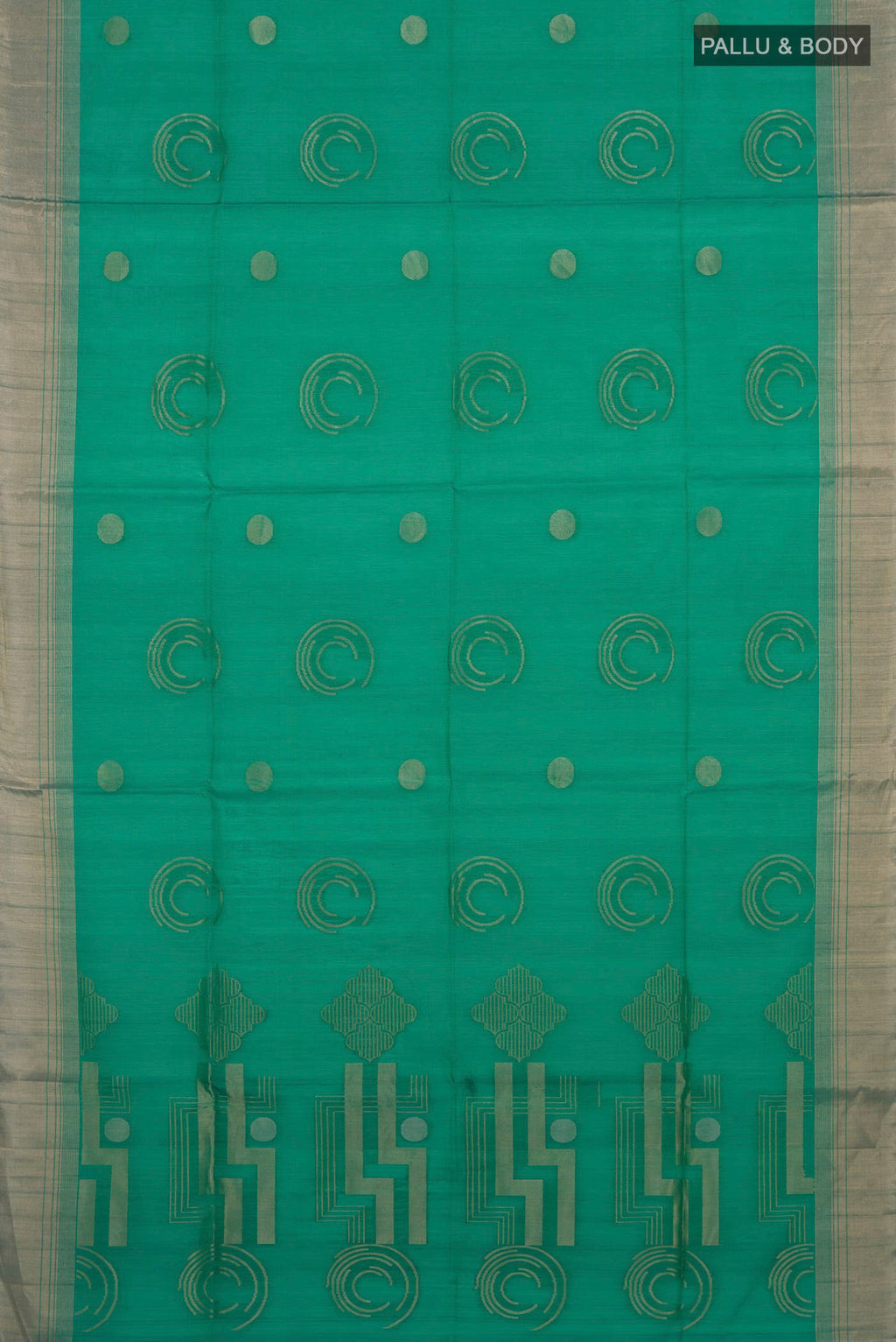 Flat view of Teal Silk Cotton Saree with Zari Butta on the body and Zari Border. 