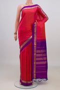 Pure Silk Brick Orange Kanchipuram Saree with Thread Butta on the body and Zari Border.  displayed on a mannequin
