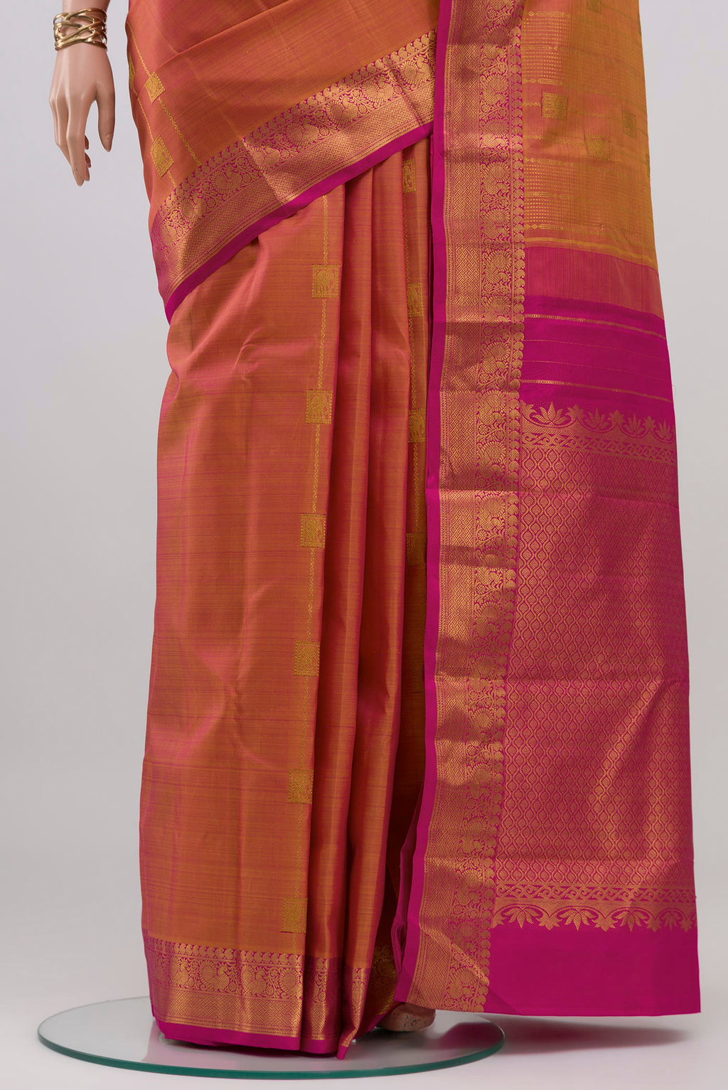 Pleats and pallu of Pinkish Yellow Dual Tone Kanjivaram Silk Saree with Stripes on the body and Zari Border. 