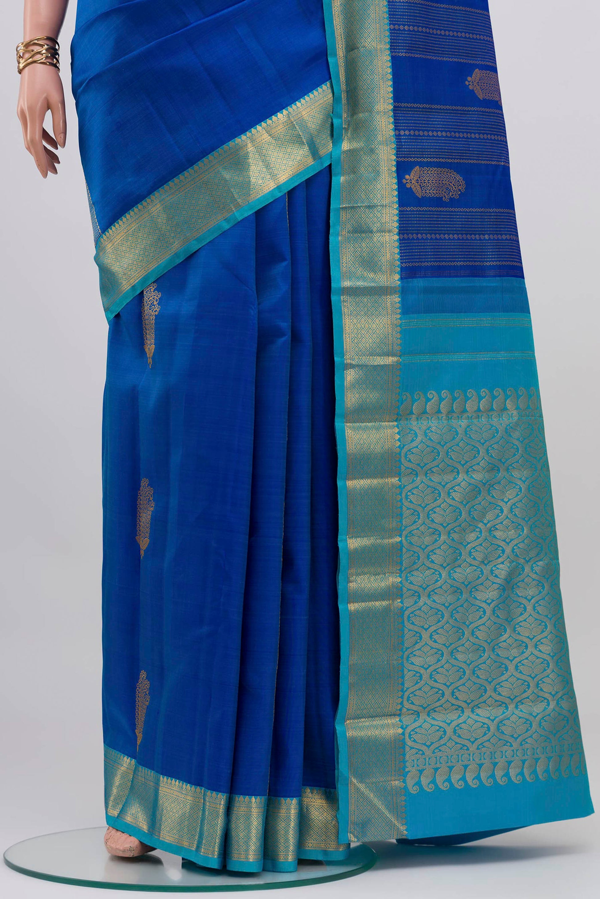 Pleats and pallu of Royal Blue Kanjivaram Silk Saree with Zari Butta on the body and Zari Border. 