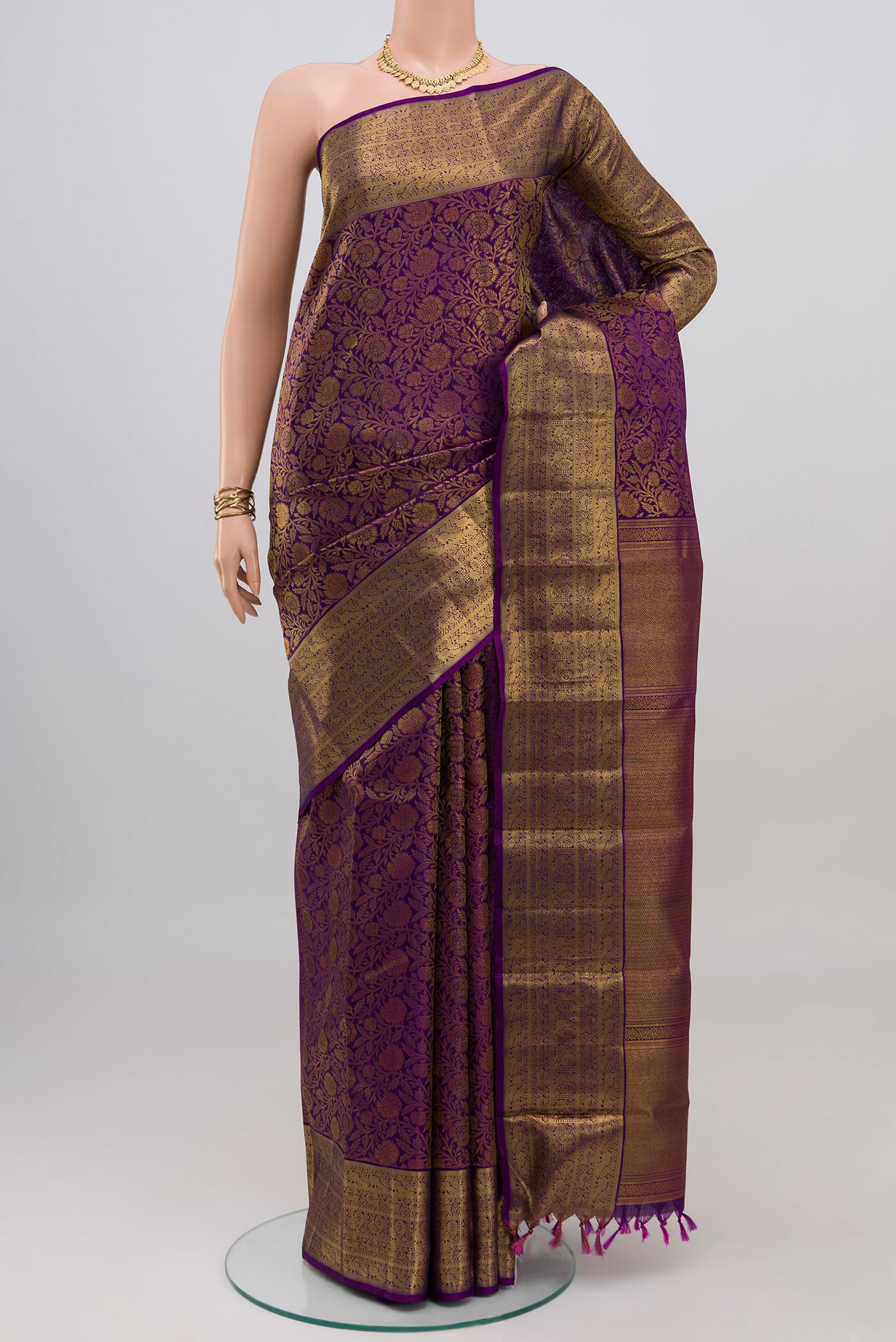 Violet Kanchipuram Silk Saree with Zari Brocade on the body and Zari Border.  displayed on a mannequin