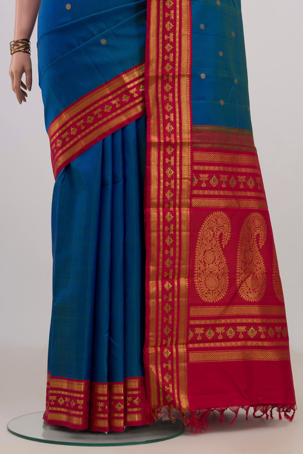 Pleats and pallu of Pure Silk Blue Kanjivaram Saree with Zari Butta on the body and Zari Border. 