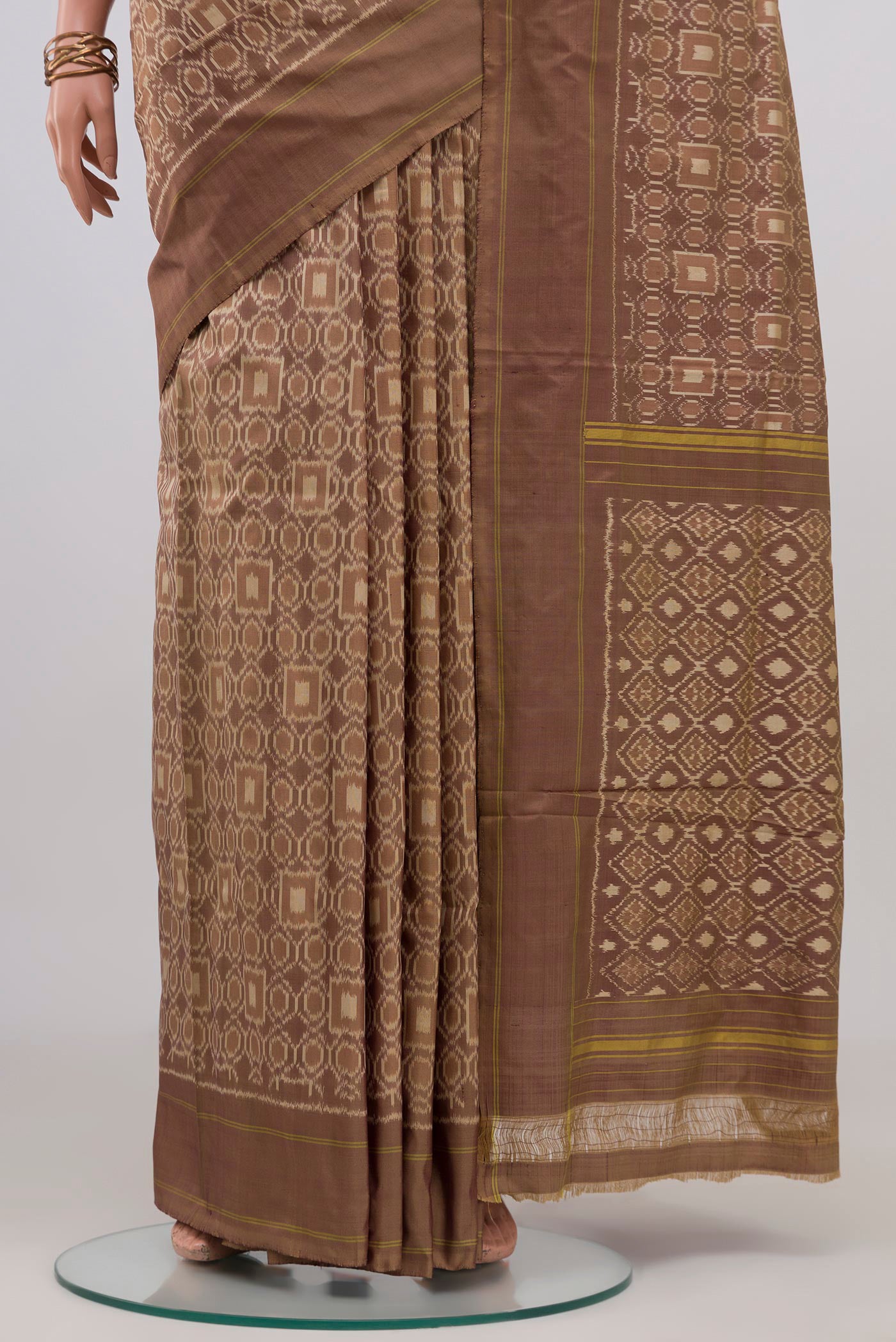 Pleats and pallu of Brown Pochampally Silk Saree with Ikat design on the body and Plain Border. 