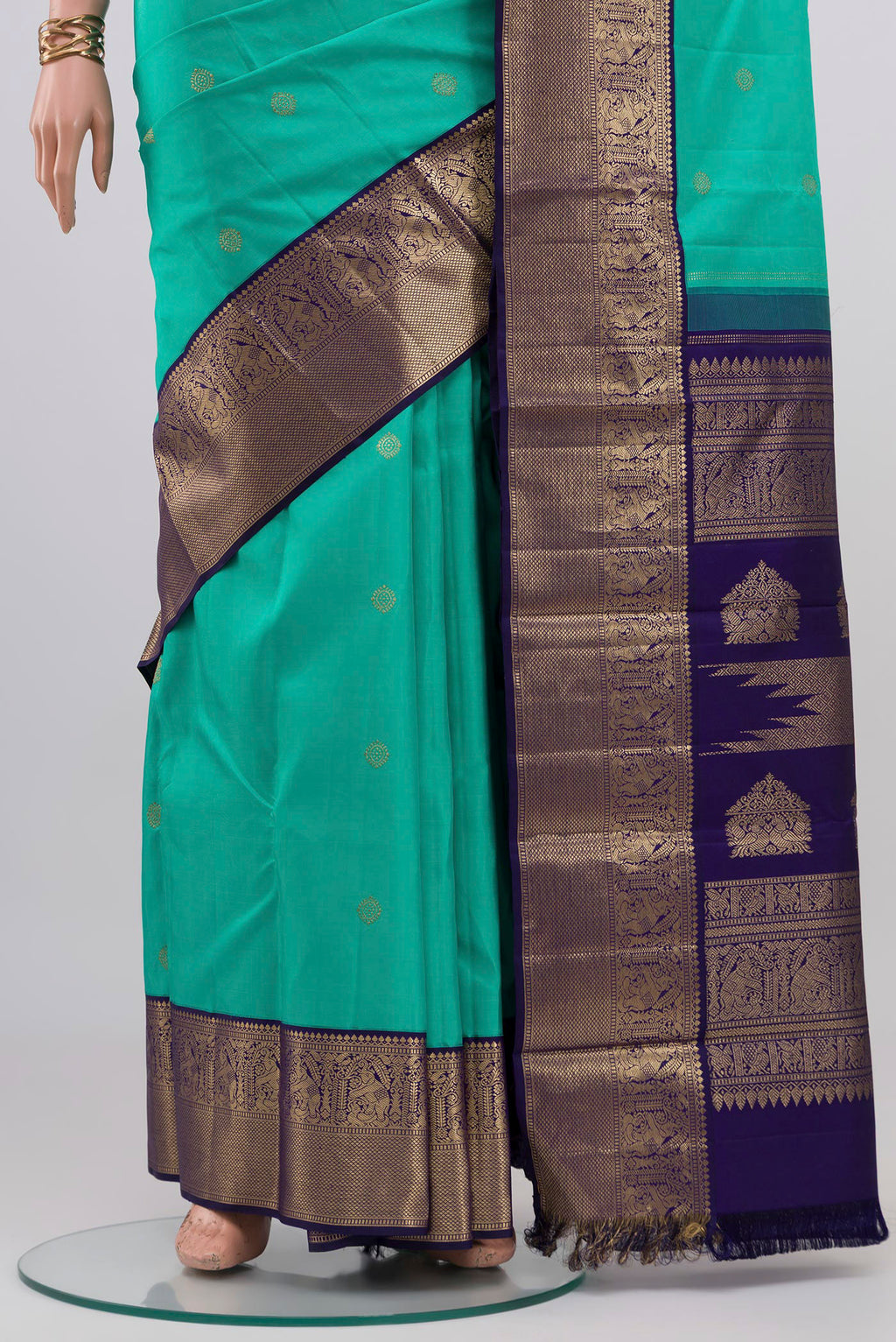 Pleats and pallu of Turquoise Kanjivaram Silk Saree with Zari Butta on the body and Zari Border. 