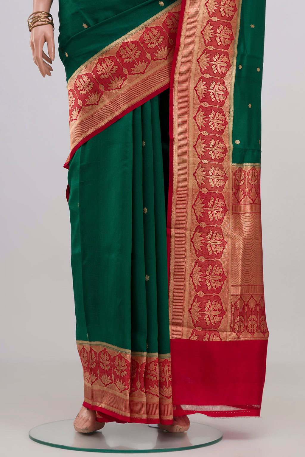 Pleats and pallu of Green Banarasi Katan Silk Saree with Zari Butta on the body and Fancy Border. 