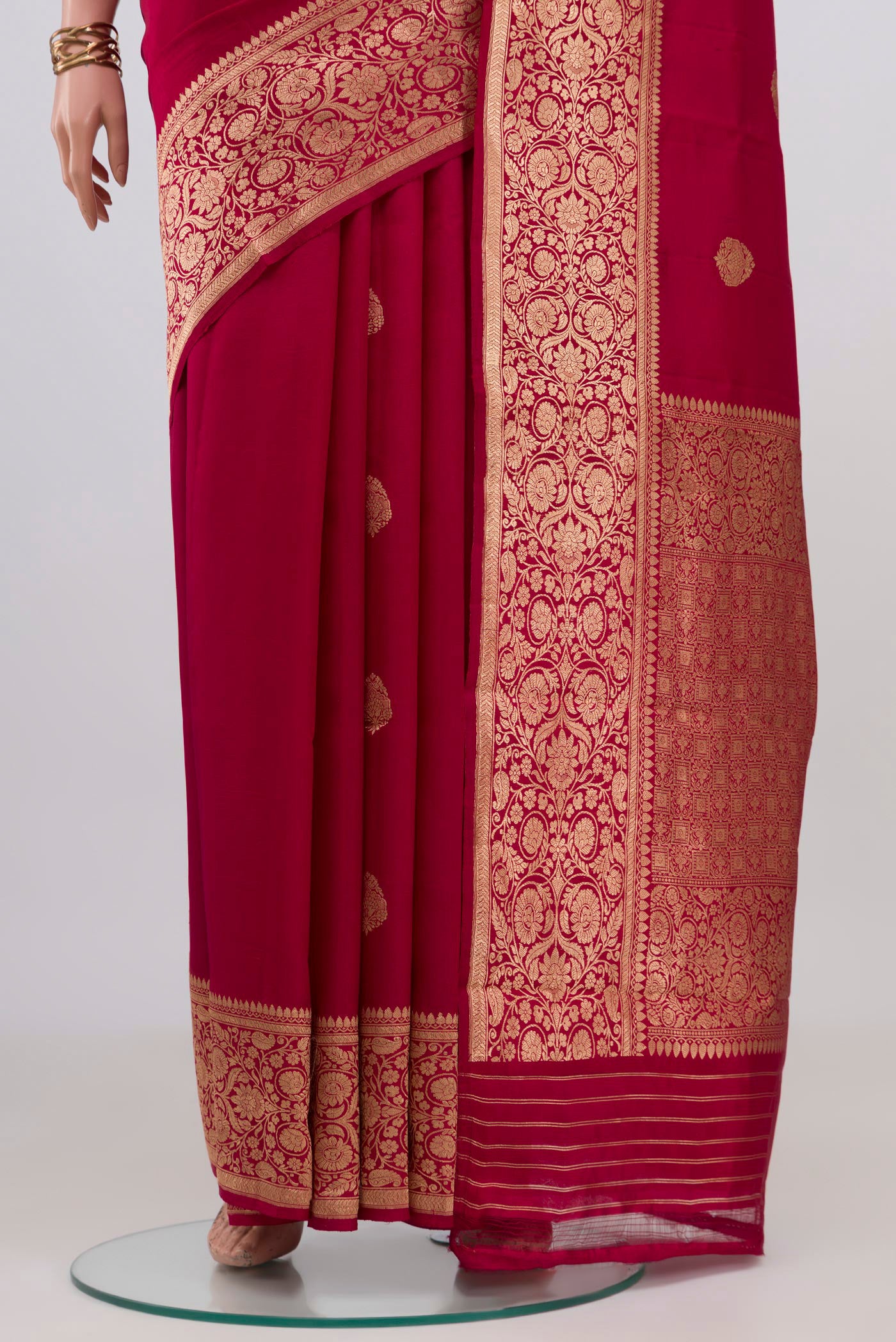 Pleats and pallu of Maroon Banarasi Katan Silk Saree with Zari Butta on the body and Zari Border. 