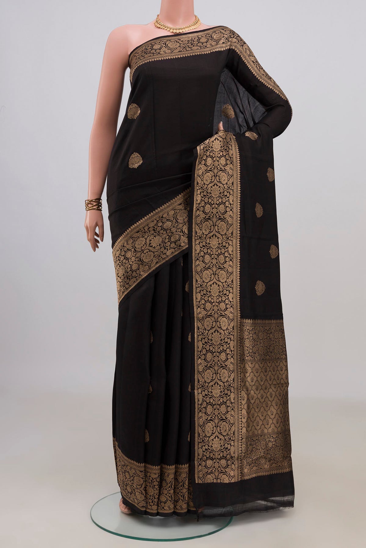 Pure Silk Black Banarasi Katan Saree with Zari Butta on the body and Zari Border.  displayed on a mannequin
