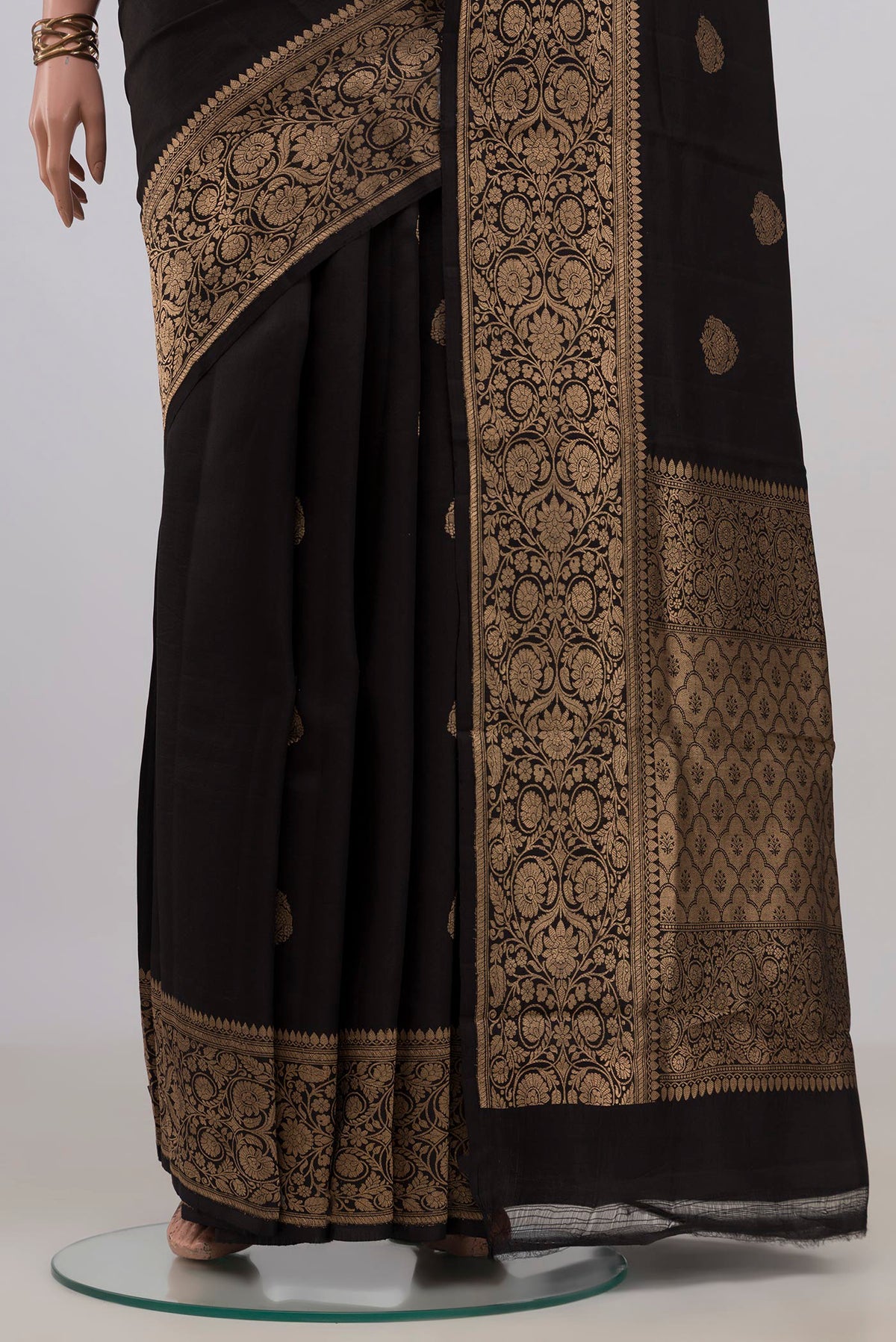 Pleats and pallu of Pure Silk Black Banarasi Katan Saree with Zari Butta on the body and Zari Border. 