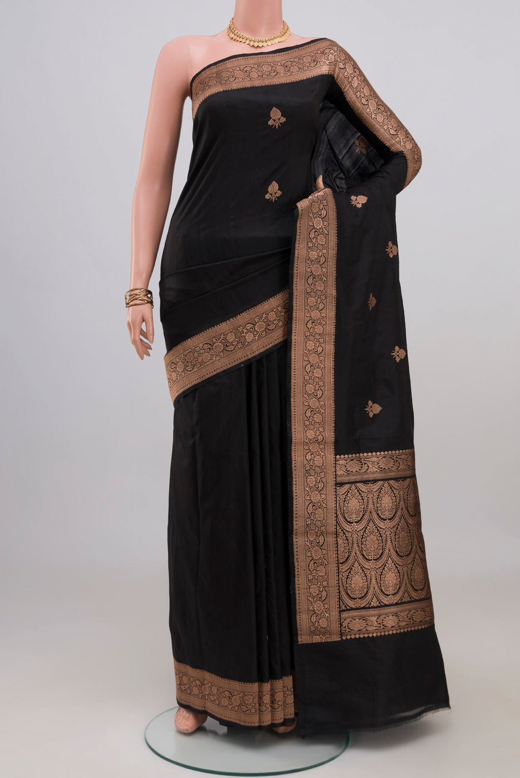 Black Banarasi Katan Silk Saree with Zari Butta on the body and Zari Border.  displayed on a mannequin