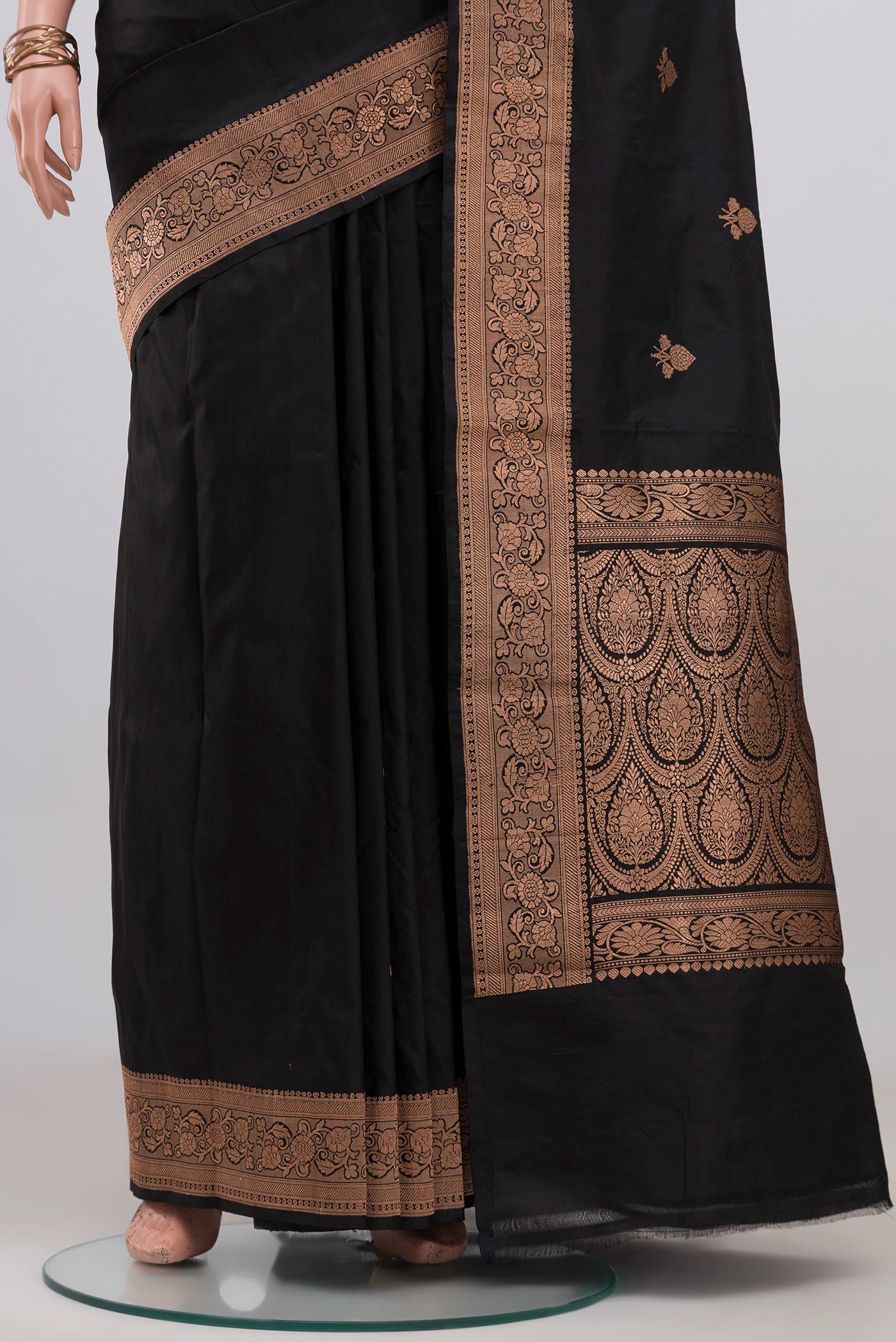 Pleats and pallu of Black Banarasi Katan Silk Saree with Zari Butta on the body and Zari Border. 