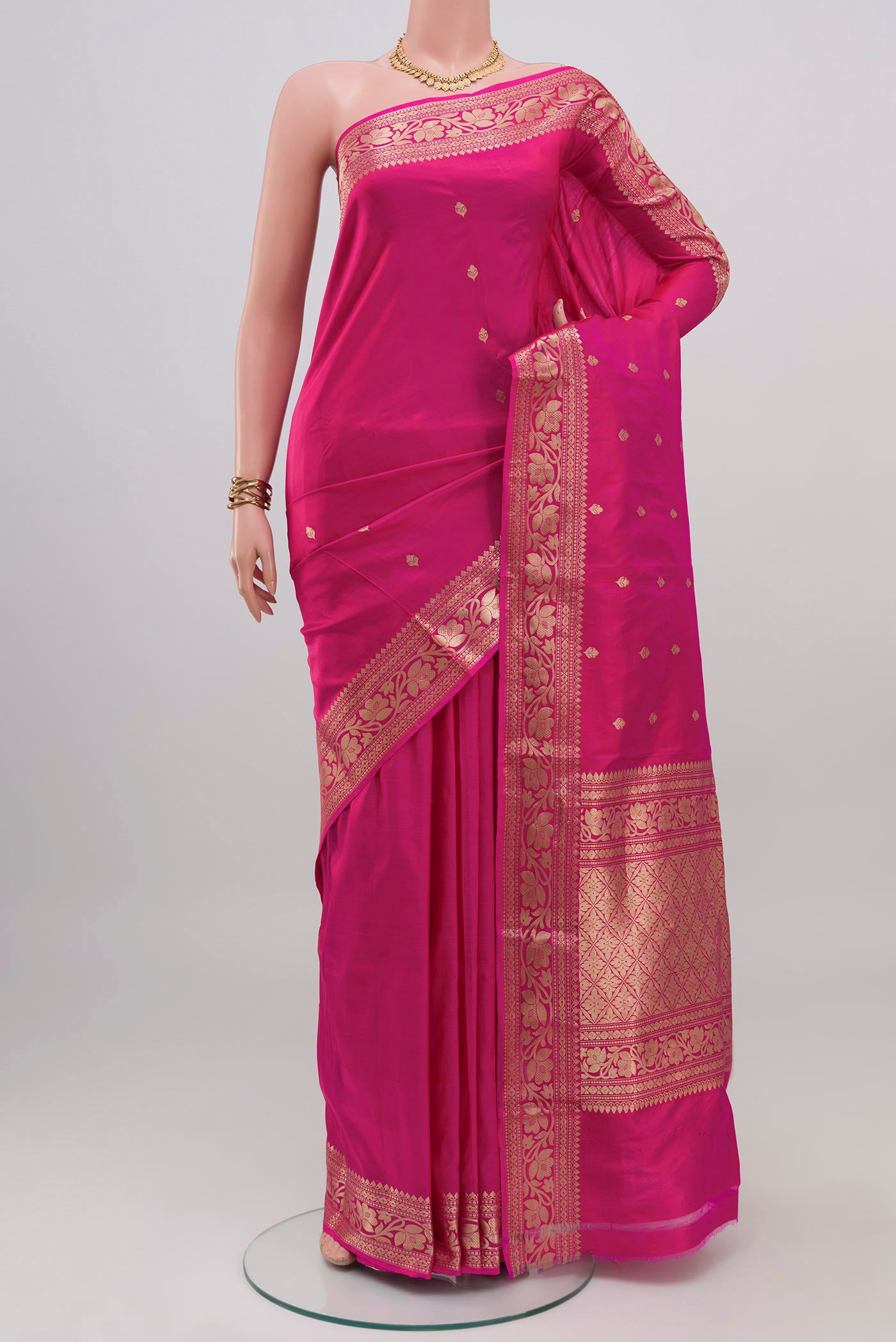 Pink Banarasi Katan Silk Saree with Zari Butta on the body and Zari Border.  displayed on a mannequin