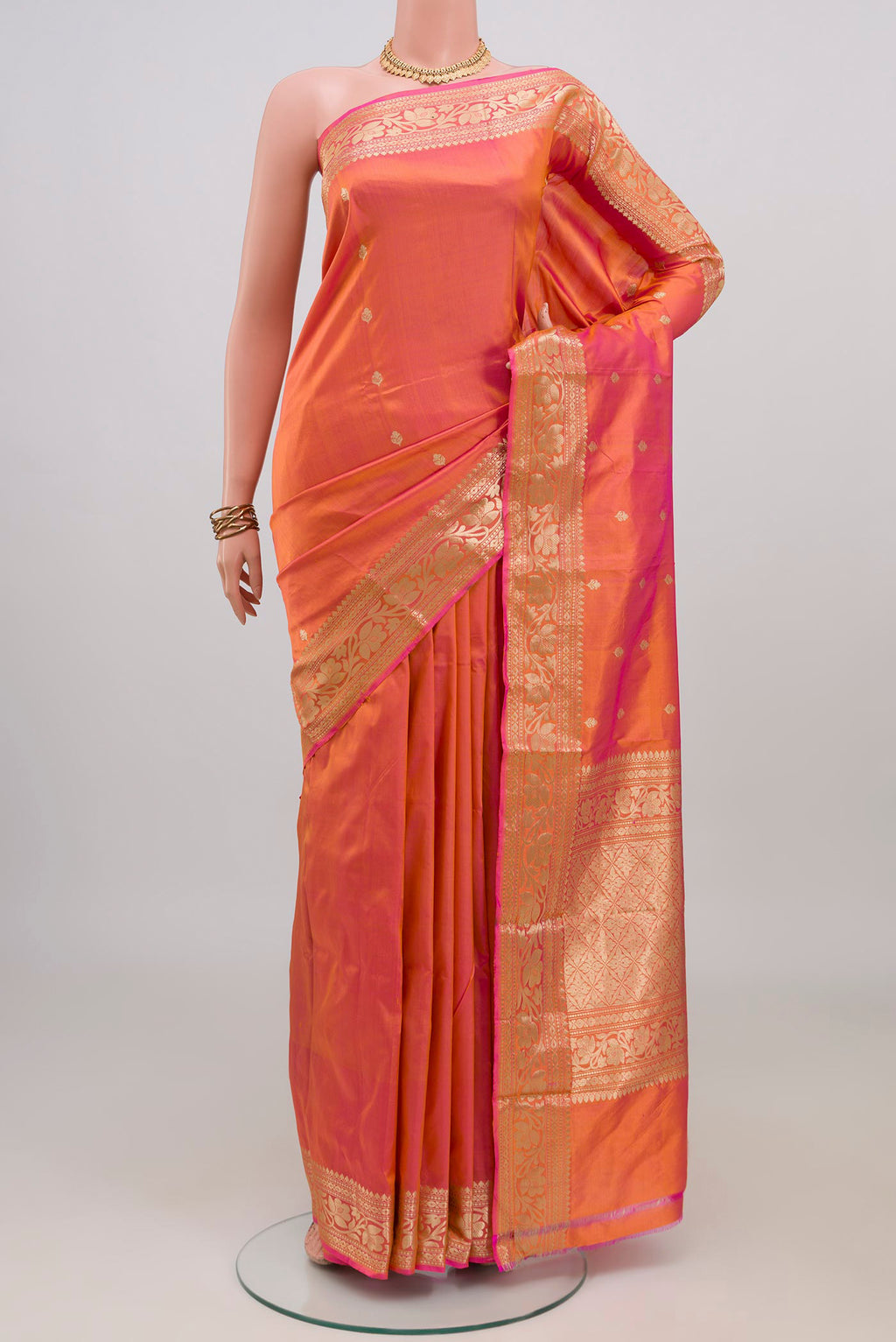 Peach Dual Tone Banarasi Katan Silk Saree with Zari Butta on the body and Zari Border.  displayed on a mannequin