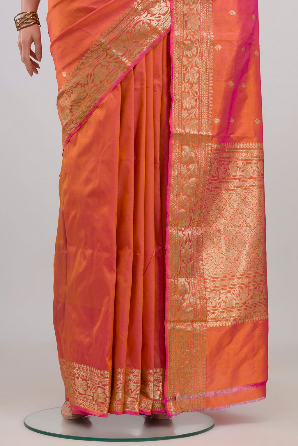 Pleats and pallu of Peach Dual Tone Banarasi Katan Silk Saree with Zari Butta on the body and Zari Border. 
