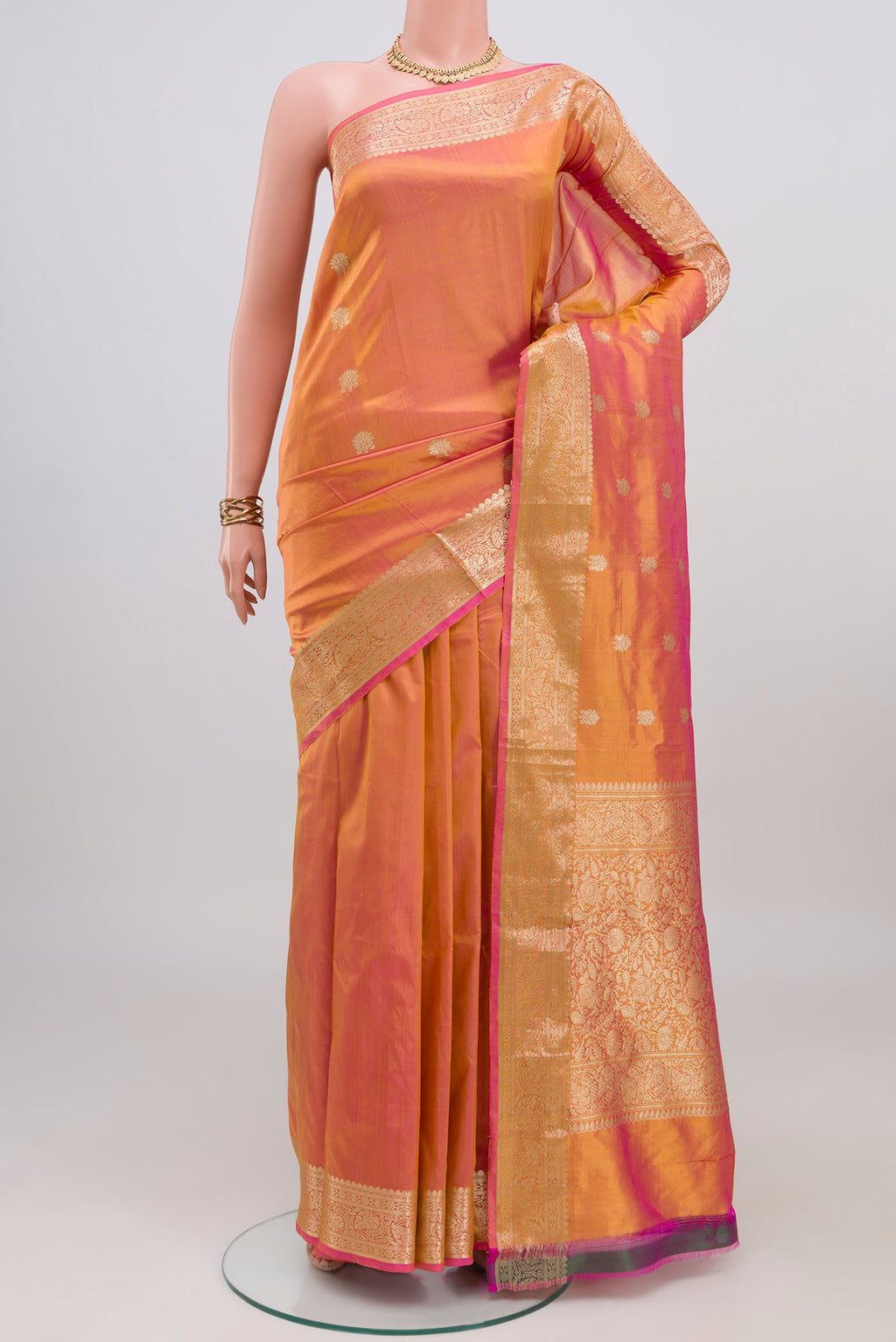 Peach Dual Tone Banarasi Katan Silk Saree with Zari Butta on the body and Zari Border.  displayed on a mannequin