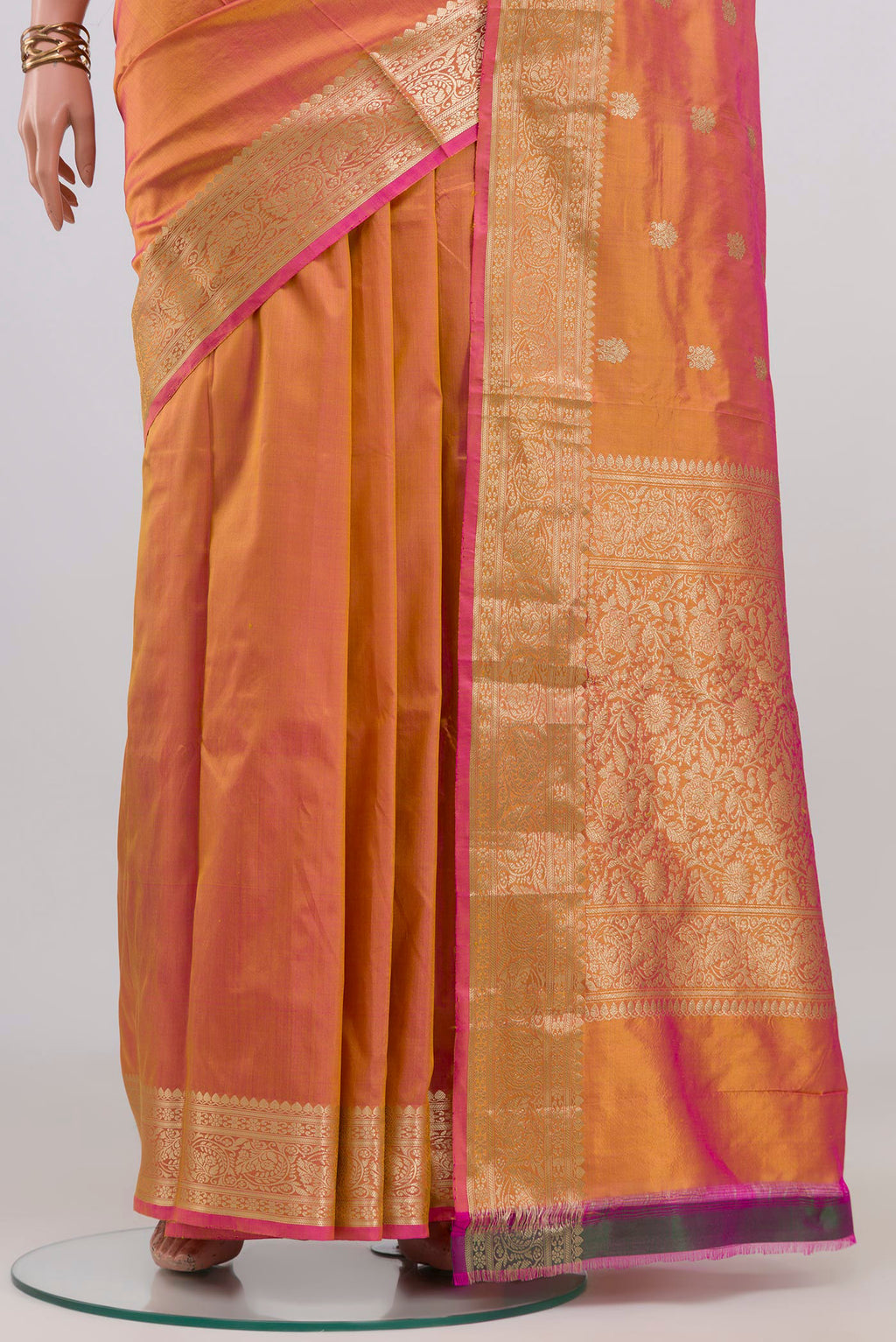 Pleats and pallu of Peach Dual Tone Banarasi Katan Silk Saree with Zari Butta on the body and Zari Border. 