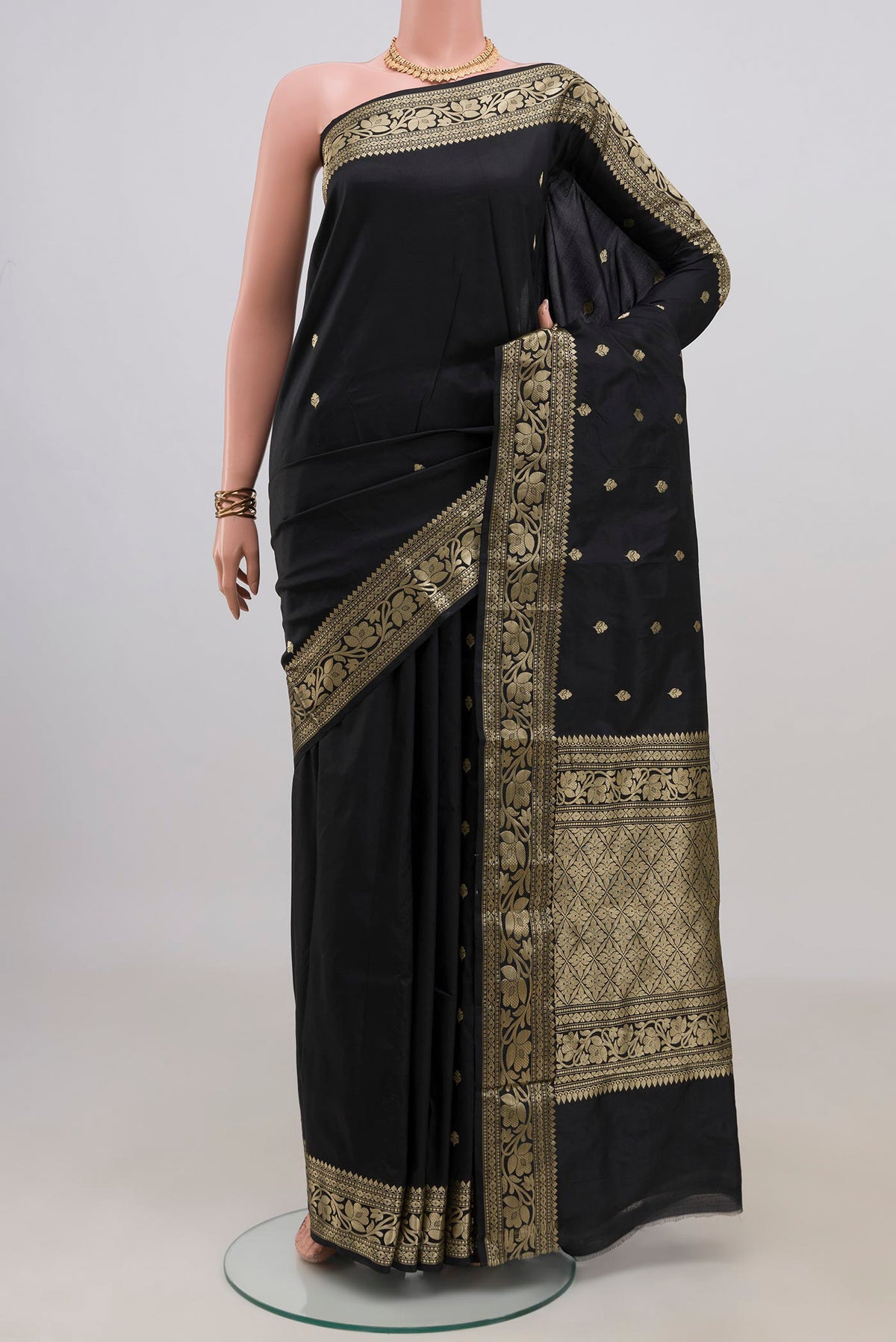 Pure Silk Black Banarasi Katan Saree with Zari Butta on the body and Fancy Border.  displayed on a mannequin