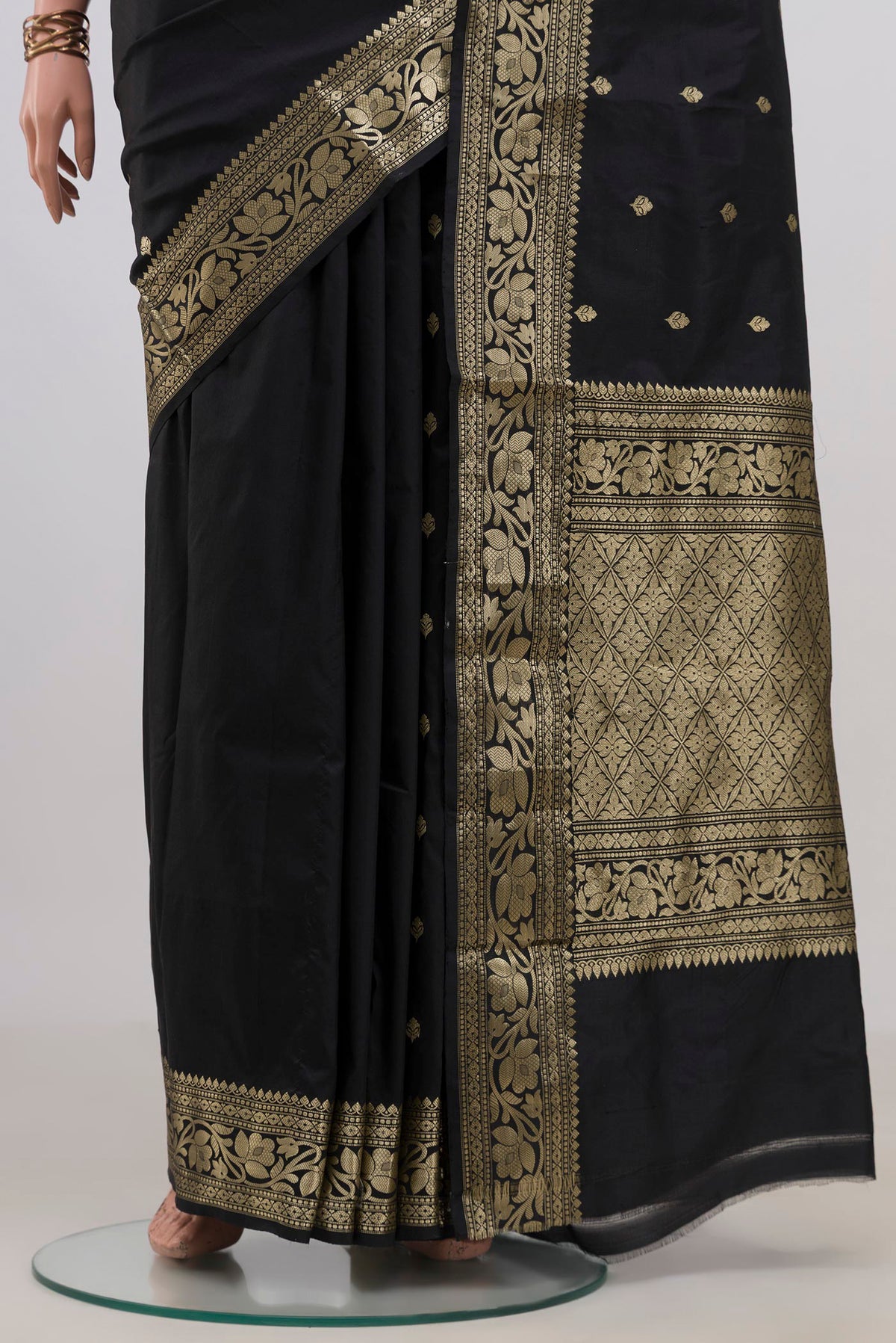 Pleats and pallu of Pure Silk Black Banarasi Katan Saree with Zari Butta on the body and Fancy Border. 