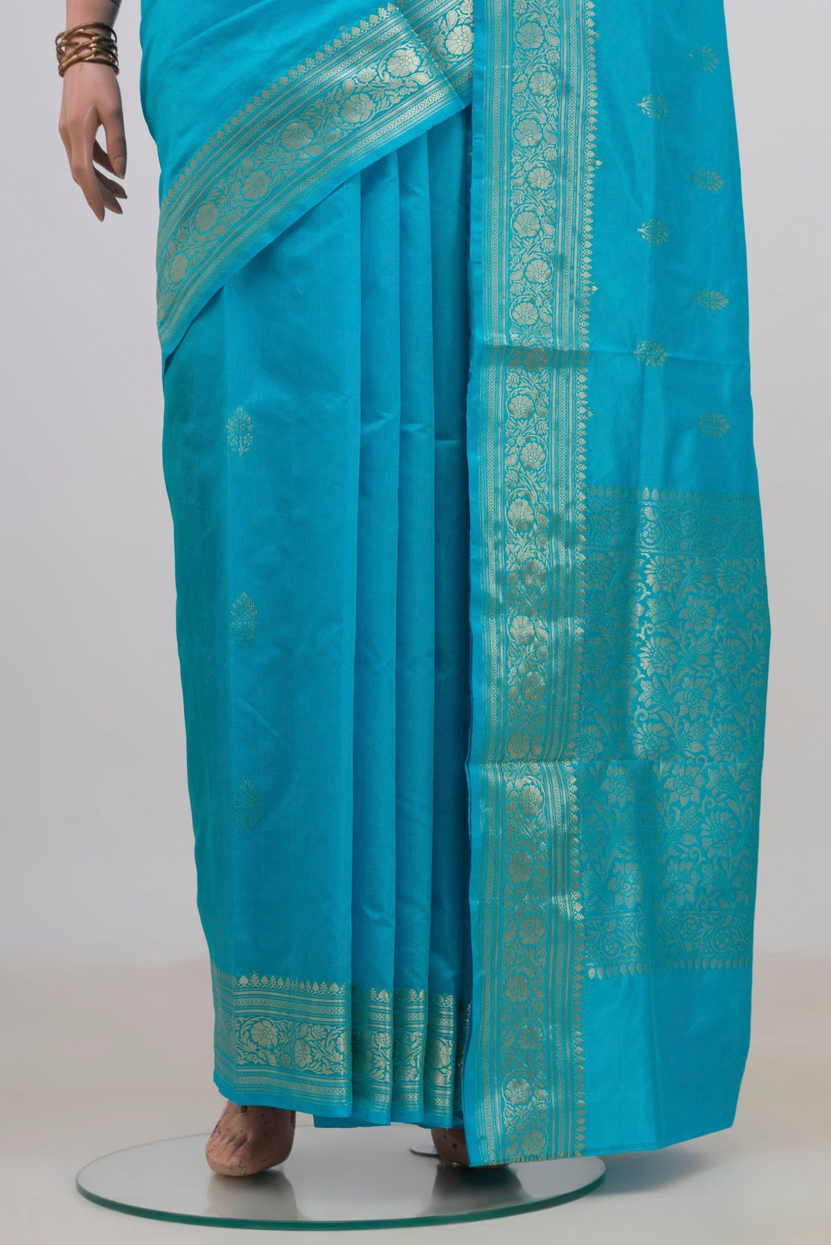 Pleats and pallu of Pure Silk Light Blue Banarasi Katan Saree with Zari Butta on the body and Zari Border. 