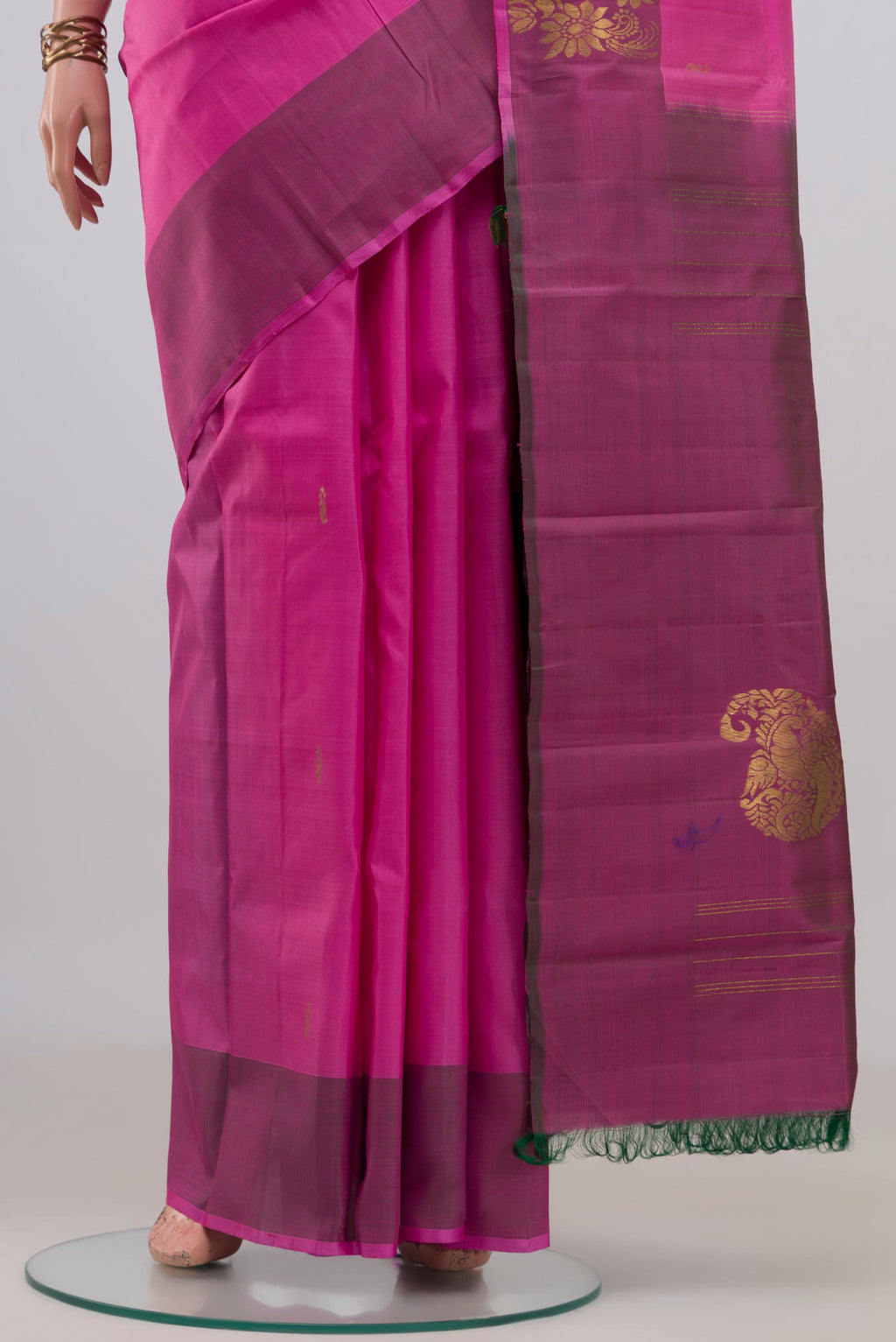 Pleats and pallu of Pure Silk Pink Kanchipuram Saree with Zari Butta on the body and Fancy Border. 
