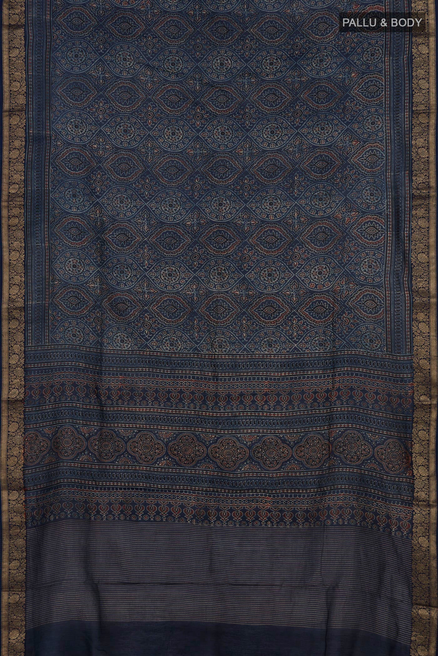 Flat view of Navy Blue Chanderi Silk Cotton Saree with Ajrakh Print on the body and Zari Border. 