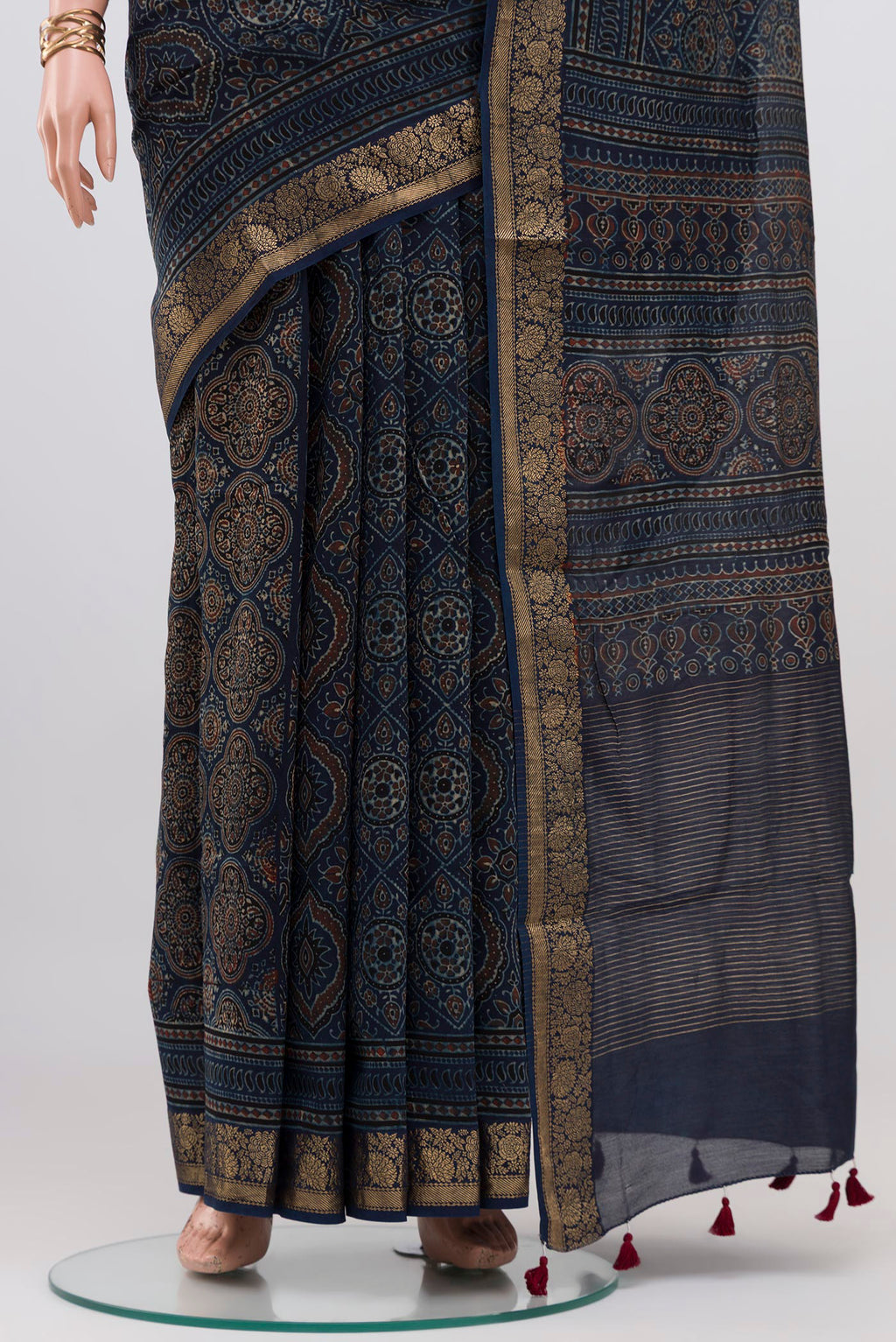 Pleats and pallu of Navy Blue Chanderi Silk Cotton Saree with Ajrakh Print on the body and Zari Border. 